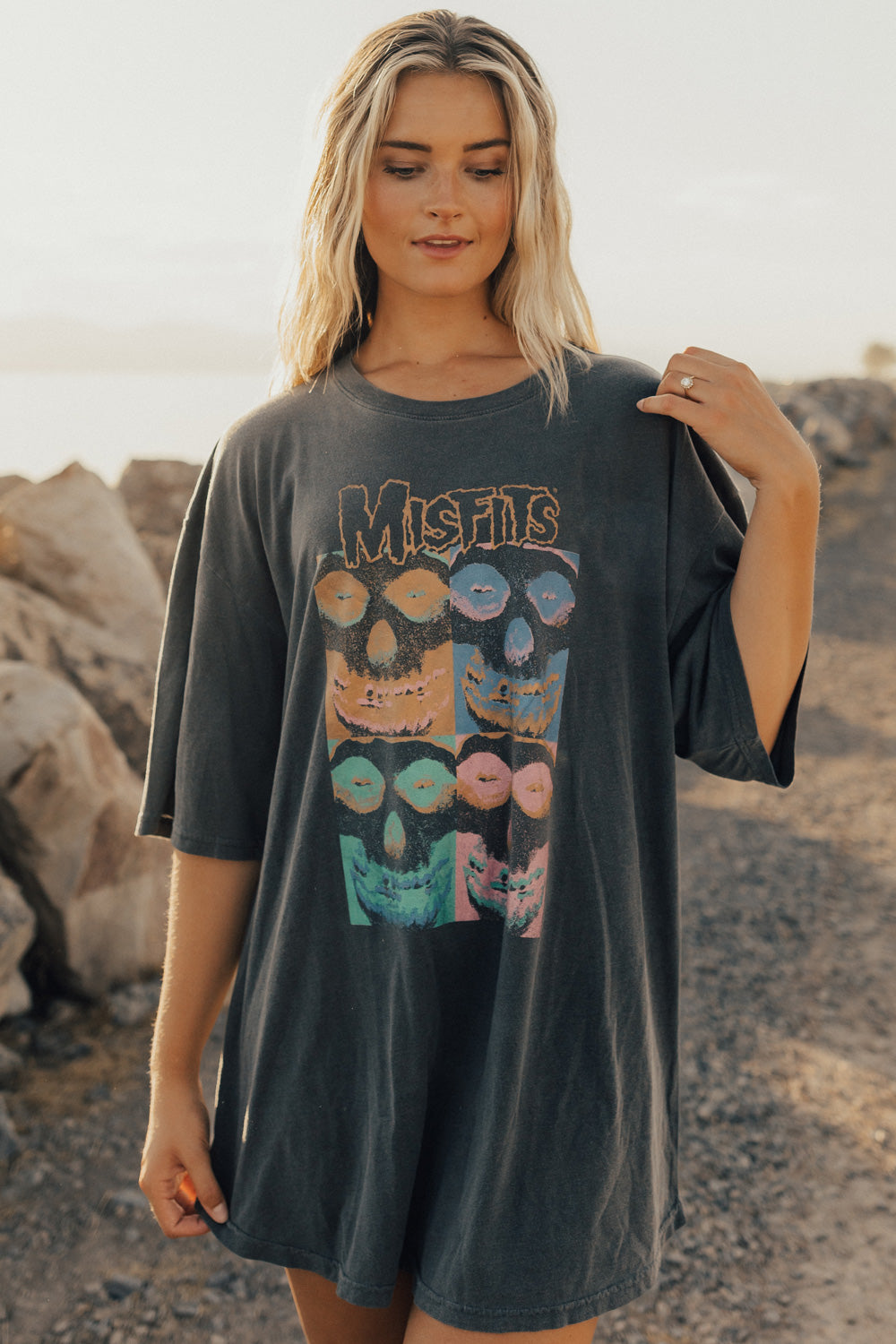 A stylish Misfits Oversized Repeat Tee in vintage black, showcasing its relaxed fit and eco-friendly fabric blend.