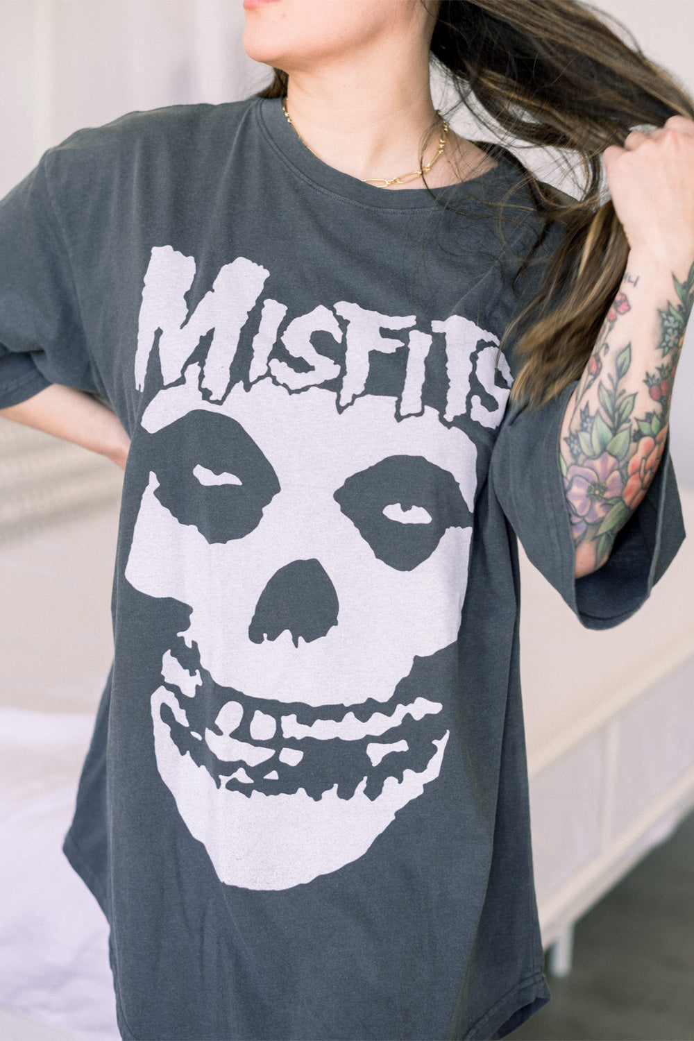 A stylish Misfits Oversized Rocker Tee in vintage black, showcasing its relaxed fit and edgy design.