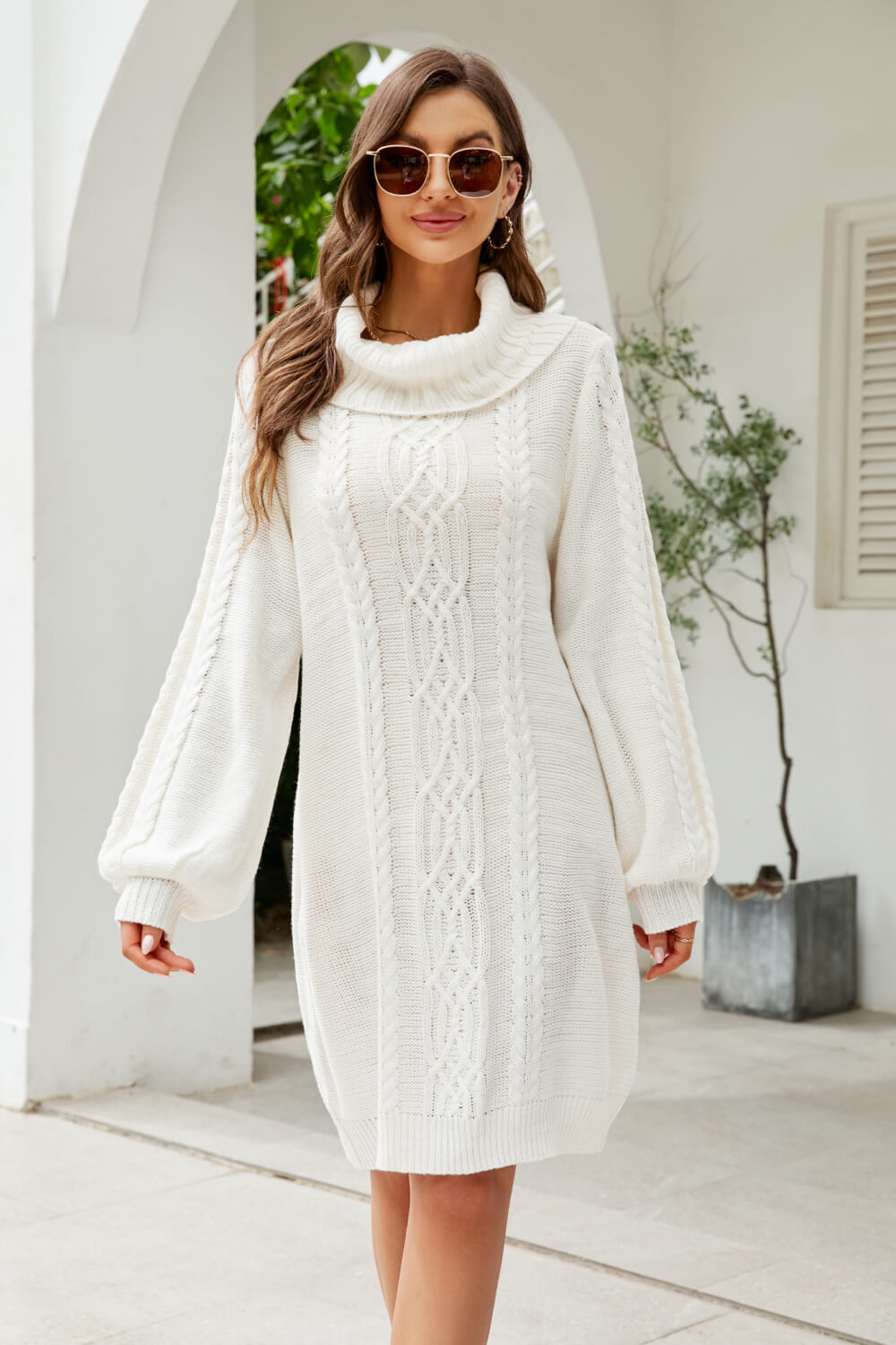 A stylish Mixed Knit Turtleneck Lantern Sleeve Sweater Dress in a solid color, featuring long lantern sleeves and a cozy turtleneck, perfect for casual outings.