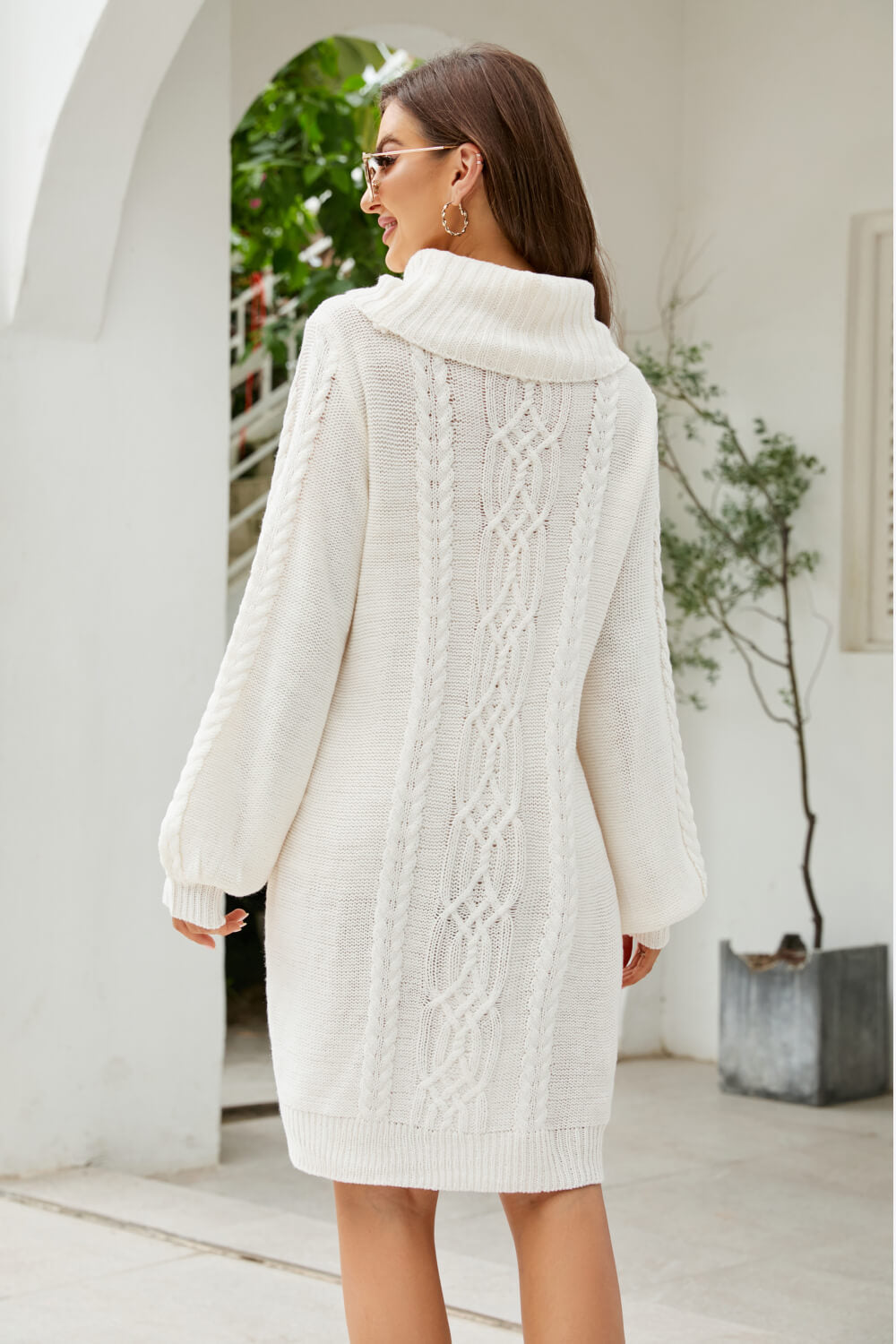 A stylish Mixed Knit Turtleneck Lantern Sleeve Sweater Dress in a solid color, featuring long lantern sleeves and a cozy turtleneck, perfect for casual outings.