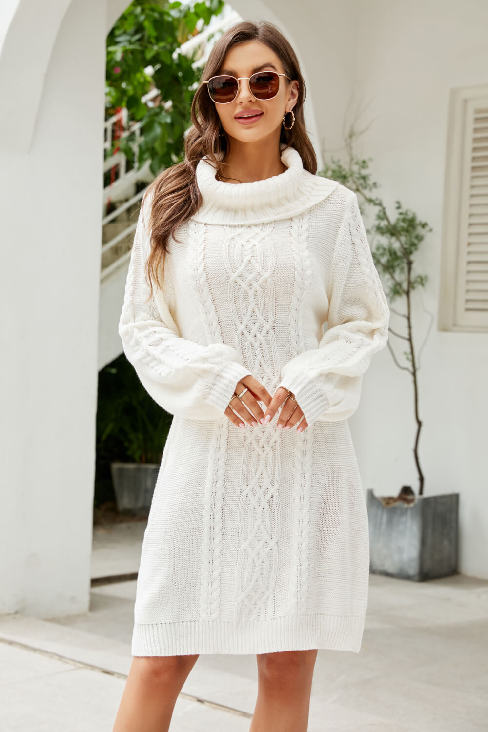 A stylish Mixed Knit Turtleneck Lantern Sleeve Sweater Dress in a solid color, featuring long lantern sleeves and a cozy turtleneck, perfect for casual outings.