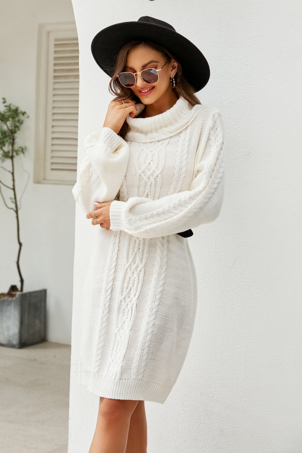 A stylish Mixed Knit Turtleneck Lantern Sleeve Sweater Dress in a solid color, featuring long lantern sleeves and a cozy turtleneck, perfect for casual outings.