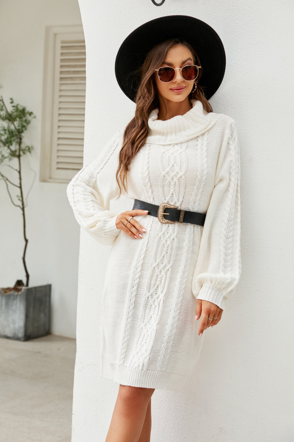 A stylish Mixed Knit Turtleneck Lantern Sleeve Sweater Dress in a solid color, featuring long lantern sleeves and a cozy turtleneck, perfect for casual outings.