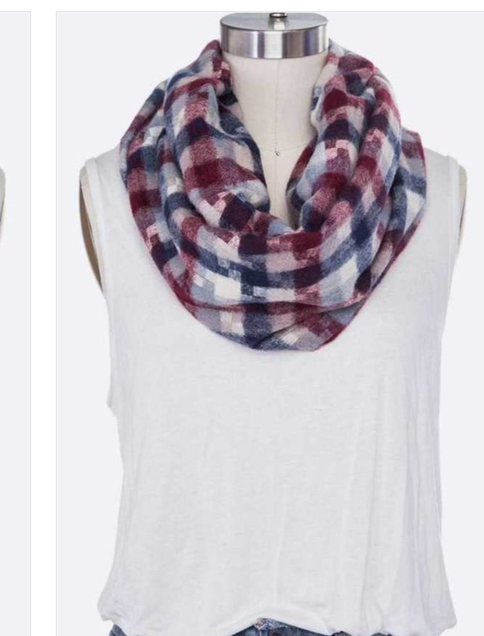 A stylish Mixed Plaid Infinity Scarf featuring vibrant color blocks, perfect for accessorizing any outfit.