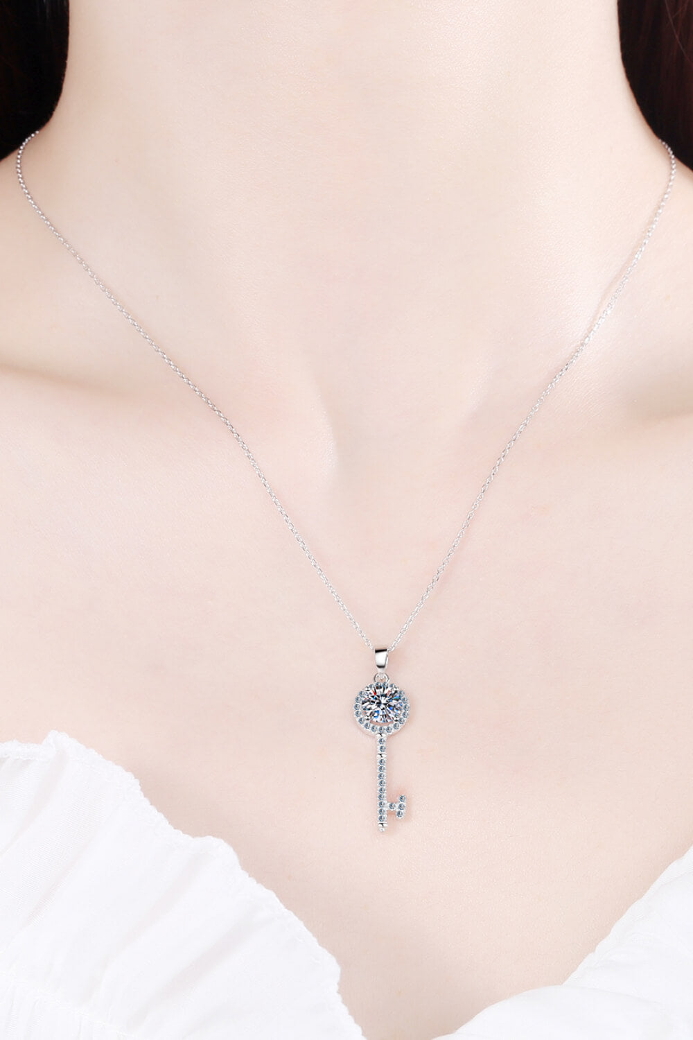 Elegant Moissanite Key Pendant Necklace in 925 sterling silver with rhinestones, showcasing a ghost mannequin style.