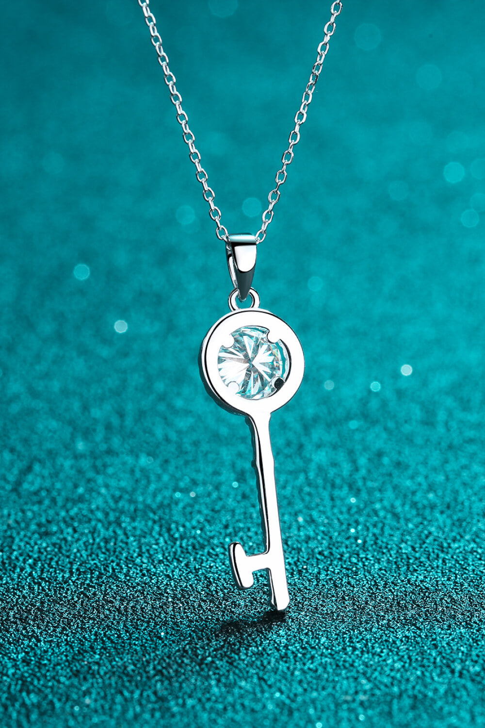 Elegant Moissanite Key Pendant Necklace in 925 sterling silver with rhinestones, showcasing a ghost mannequin style.