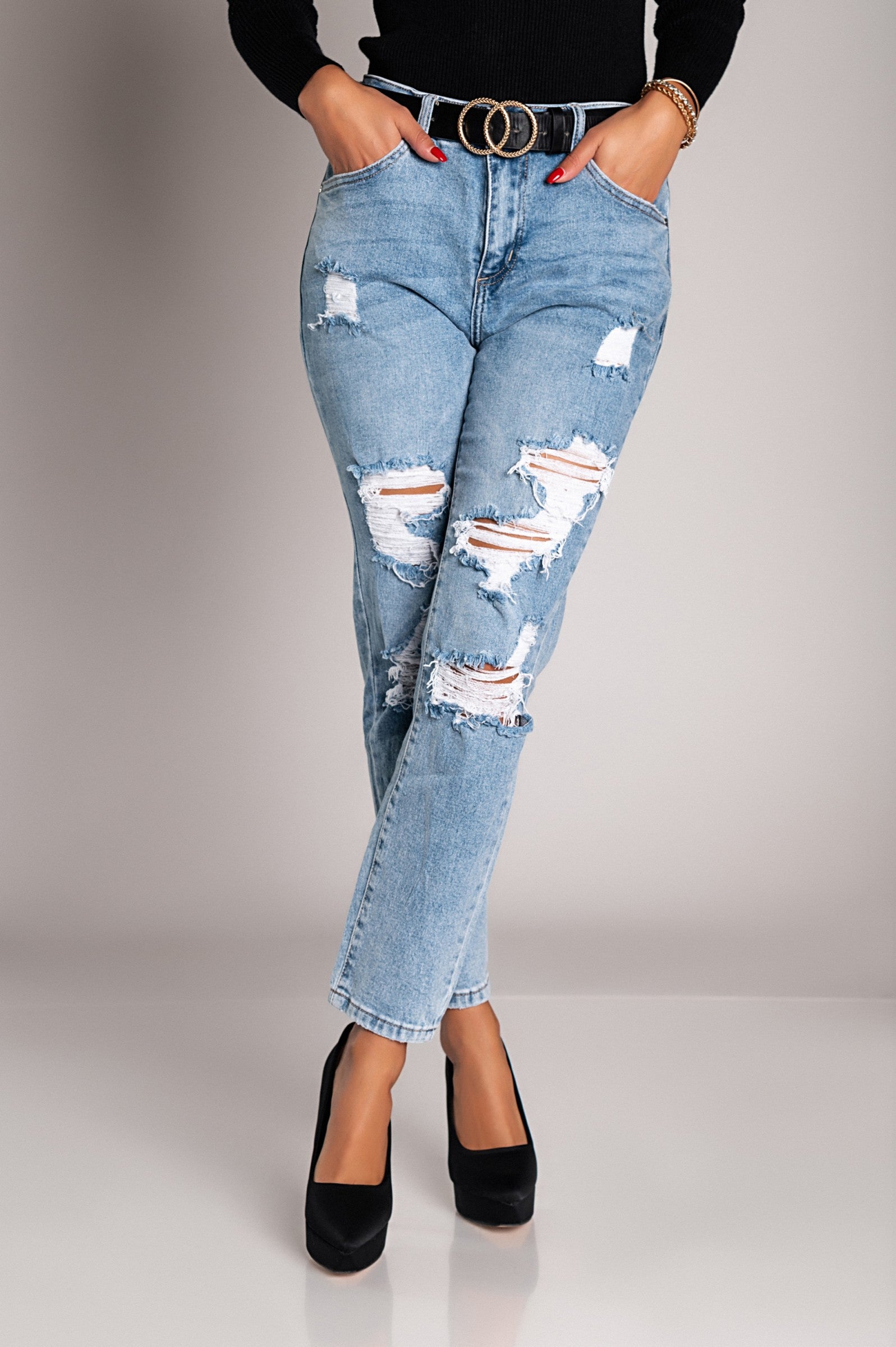 Light blue Mom fit jeans with rips, featuring a straight cut, button and zipper closure, and front and back pockets.