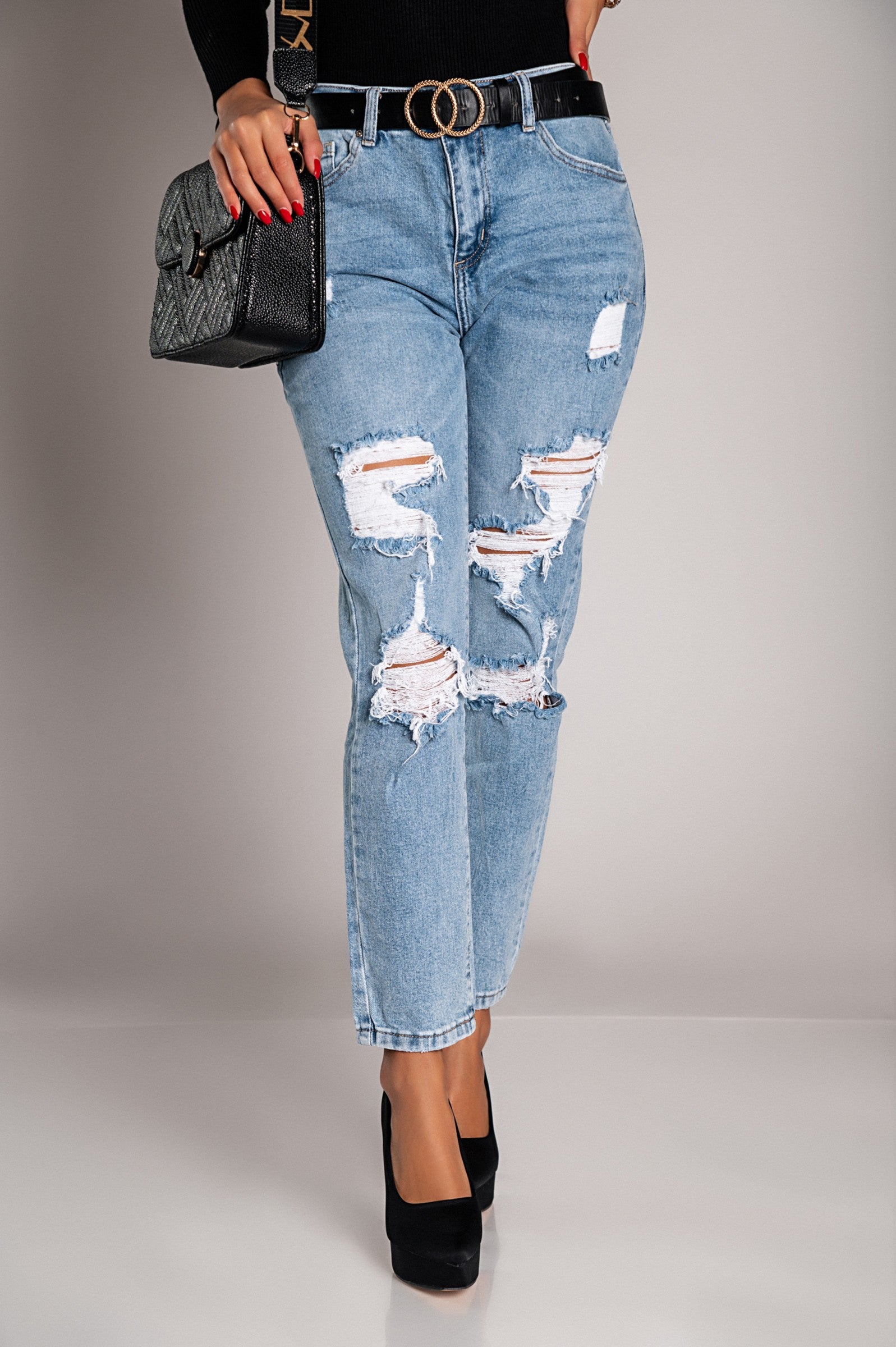 Light blue Mom fit jeans with rips, featuring a straight cut, button and zipper closure, and front and back pockets.