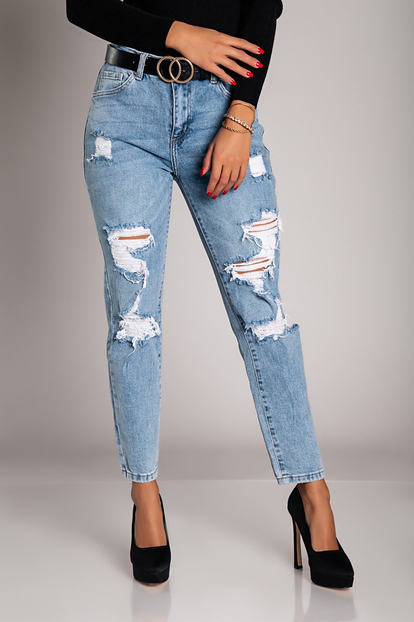 Light blue Mom fit jeans with rips, featuring a straight cut, button and zipper closure, and front and back pockets.