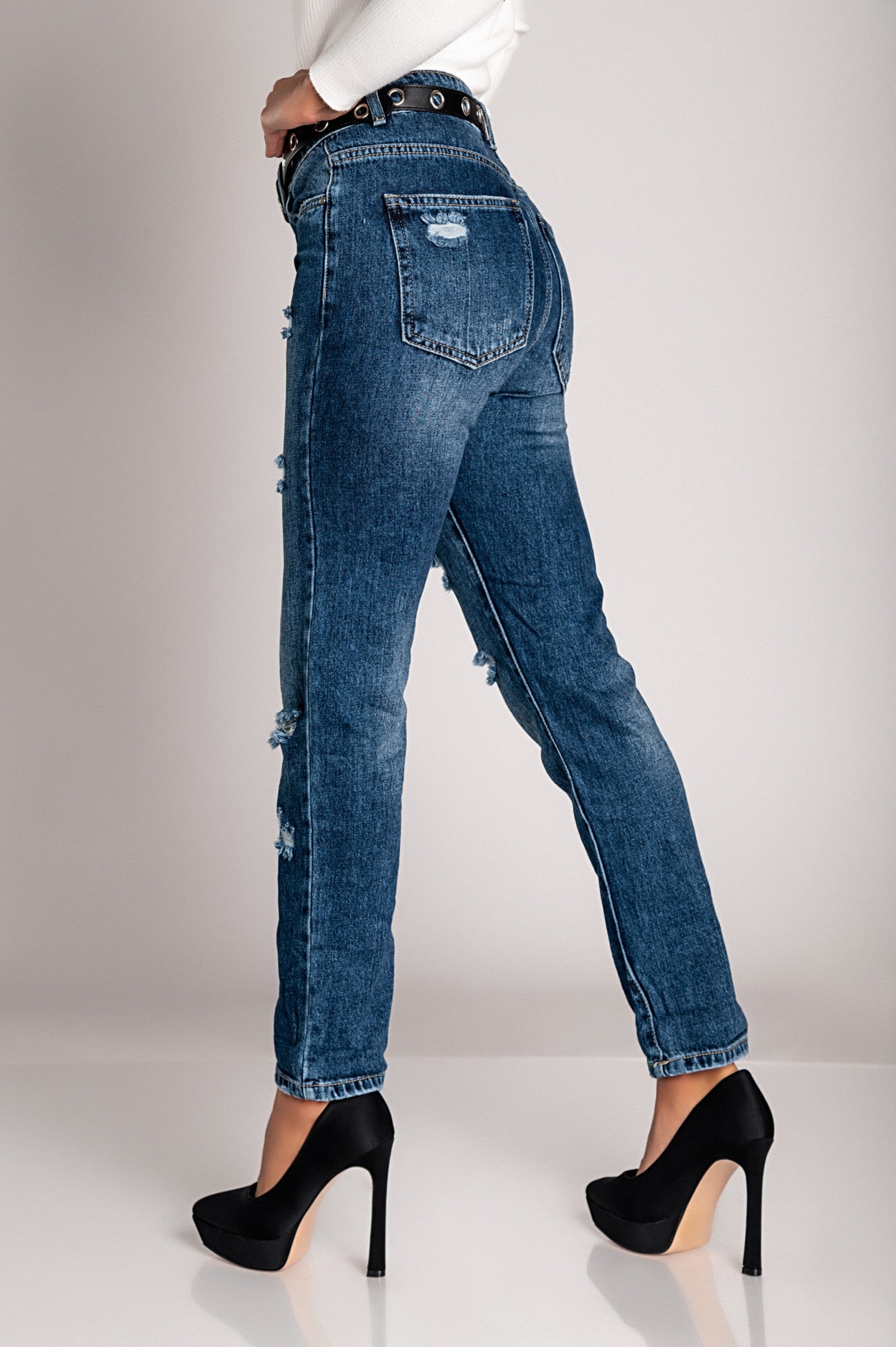 Woman in blue jeans, heels.