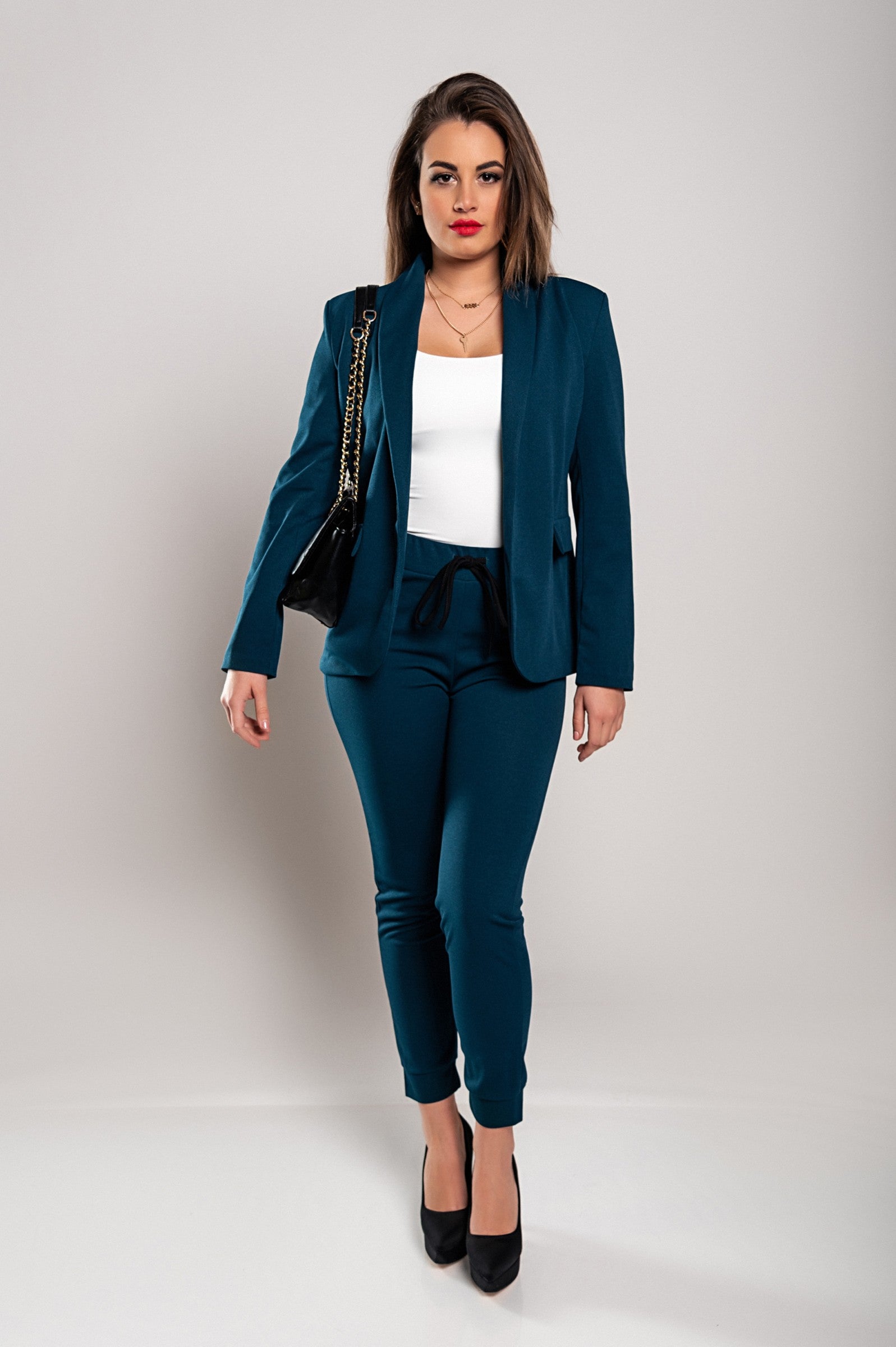 Monochrome elegant trousers and blazer set in petrol color, featuring a classic collar, long sleeves, and slim fit trousers with a drawstring waist.