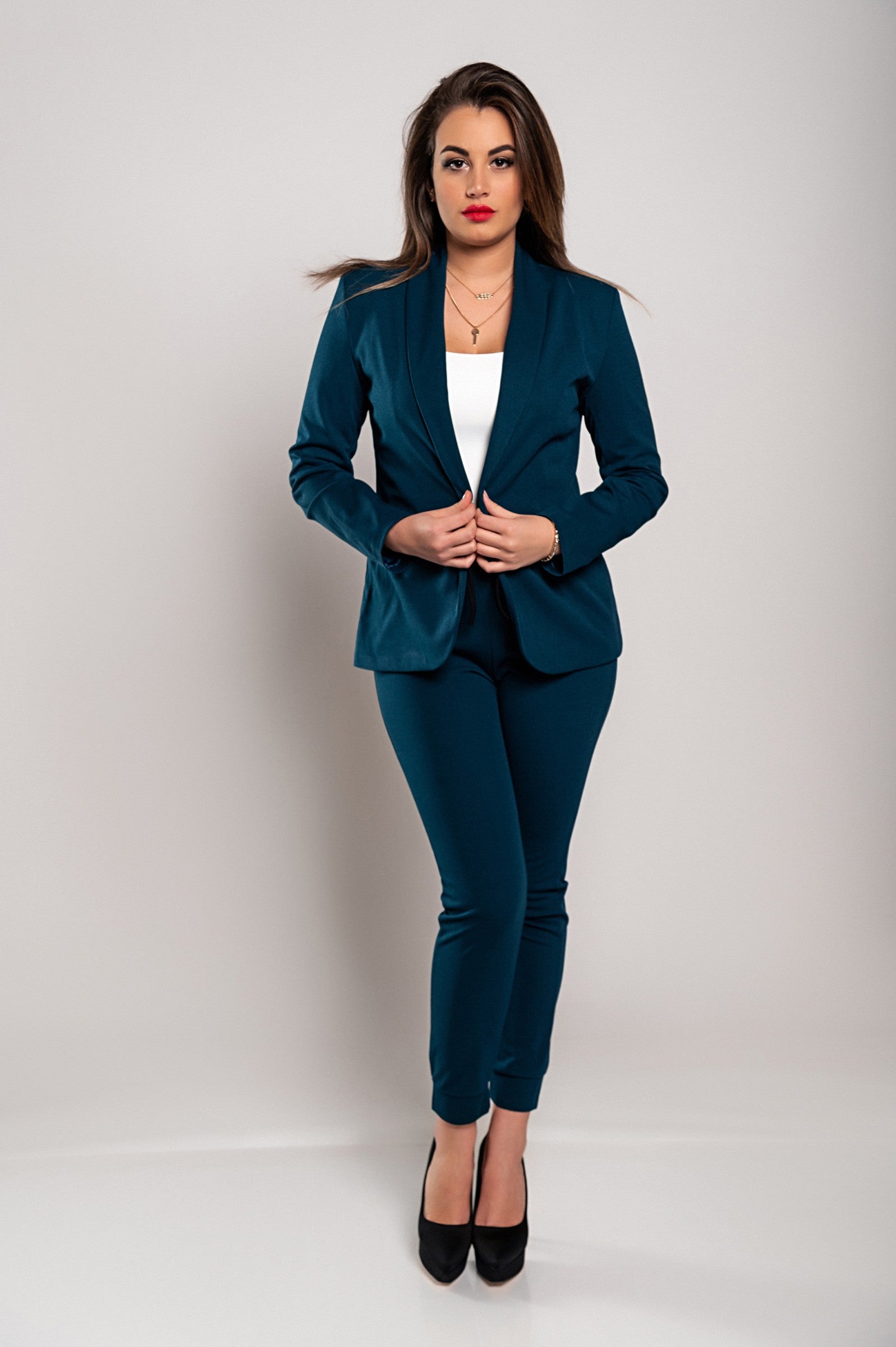 Monochrome elegant trousers and blazer set in petrol color, featuring a classic collar, long sleeves, and slim fit trousers with a drawstring waist.