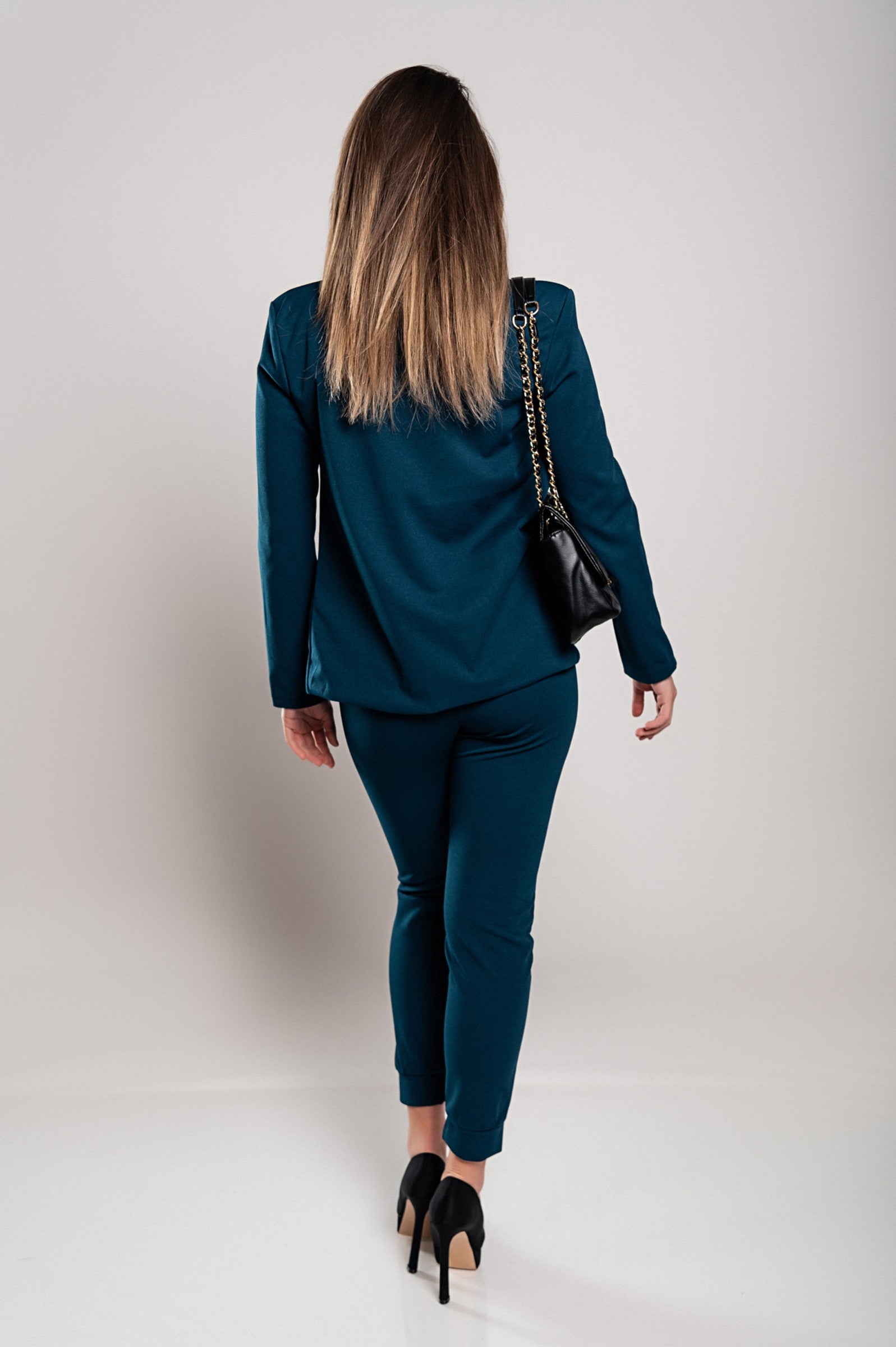 Monochrome elegant trousers and blazer set in petrol color, featuring a classic collar, long sleeves, and slim fit trousers with a drawstring waist.