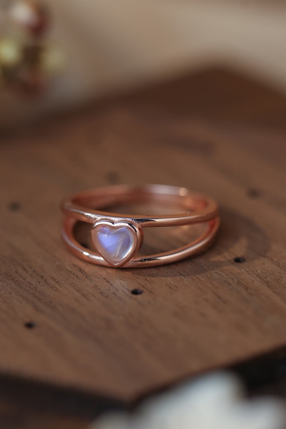 Moonstone Heart 925 Sterling Silver Ring showcasing a natural moonstone with a translucent white and blue-violet hue, set in a modern design.