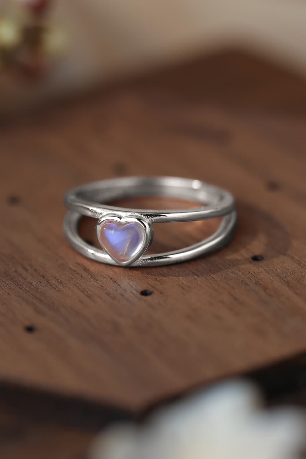 Moonstone Heart 925 Sterling Silver Ring showcasing a natural moonstone with a translucent white and blue-violet hue, set in a modern design.