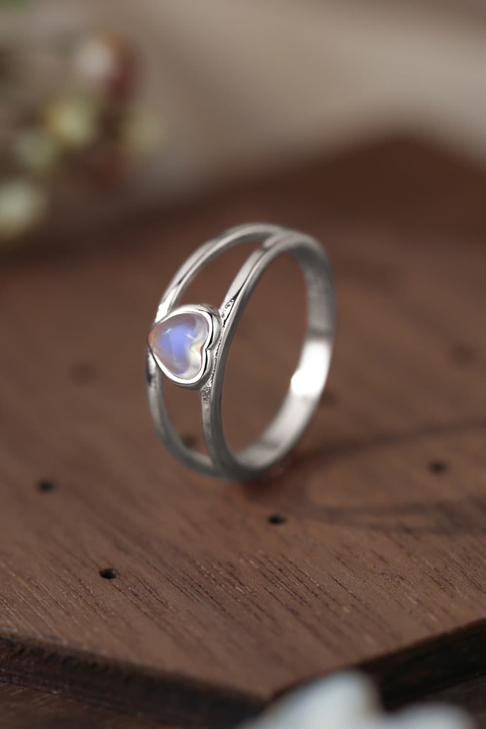 Moonstone Heart 925 Sterling Silver Ring showcasing a natural moonstone with a translucent white and blue-violet hue, set in a modern design.