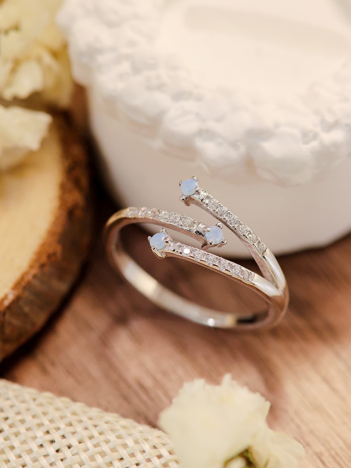 Moonstone Platinum-Plated Ring featuring a natural moonstone with blue-violet hues, set in 925 sterling silver and platinum plating.