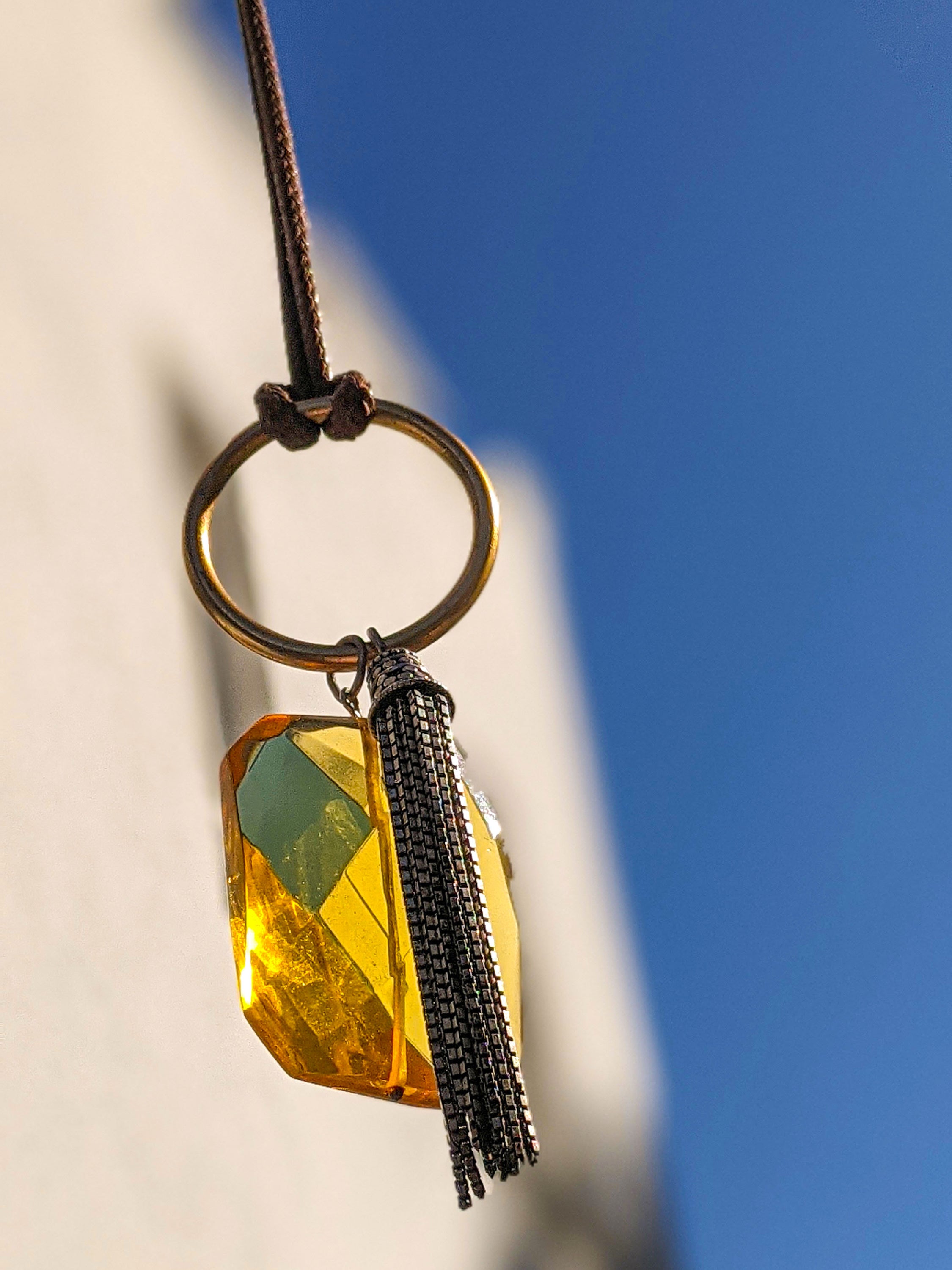 MORAY semi-precious crystal gem elegantly displayed on a silver chain, showcasing its unique design and sparkle.