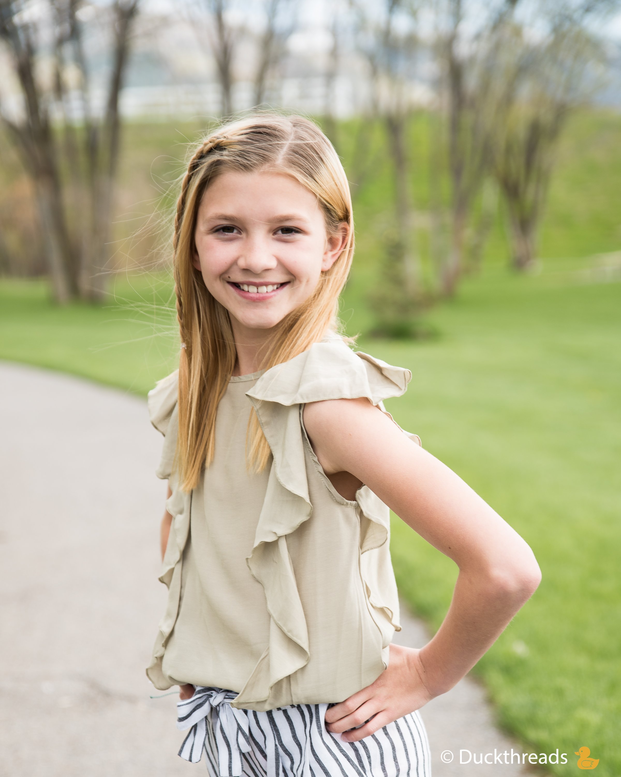 MORGAN Side Flutter Top in Sage featuring side ruffles, lightweight fabric, perfect for sunny days.