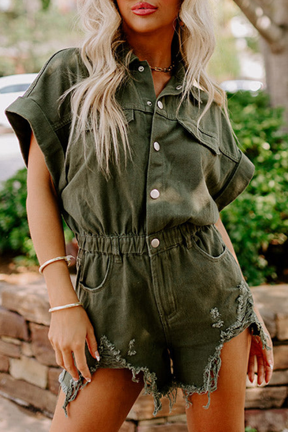 Moss Green Distressed Frayed Denim Romper featuring rolled cuffs and button closure, perfect for casual outings.