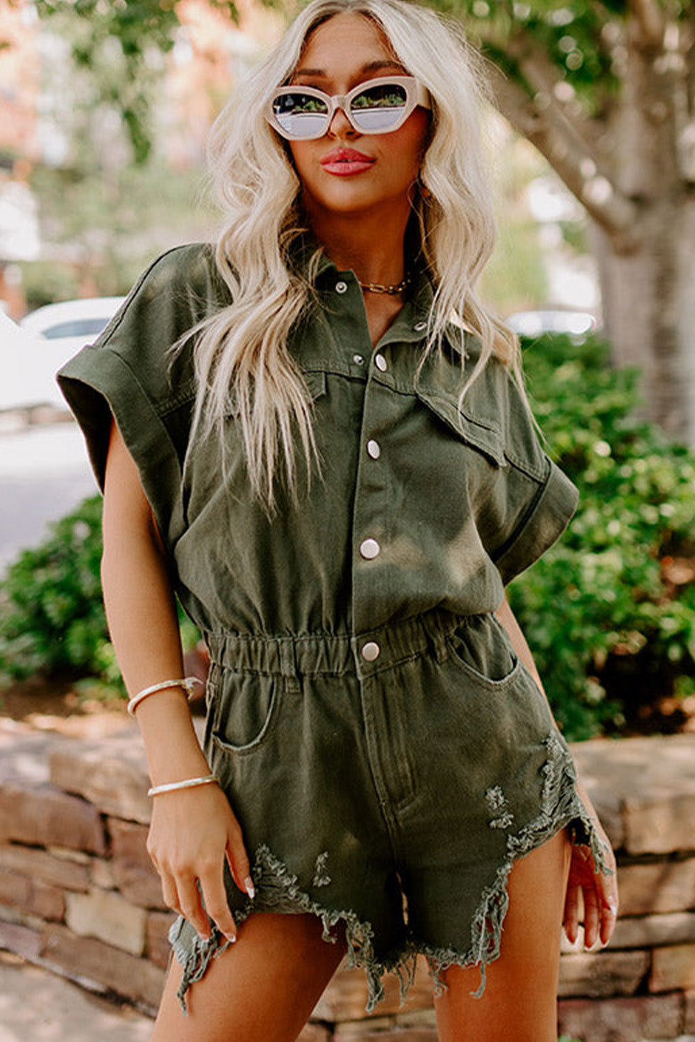 Moss Green Distressed Frayed Denim Romper featuring rolled cuffs and button closure, perfect for casual outings.