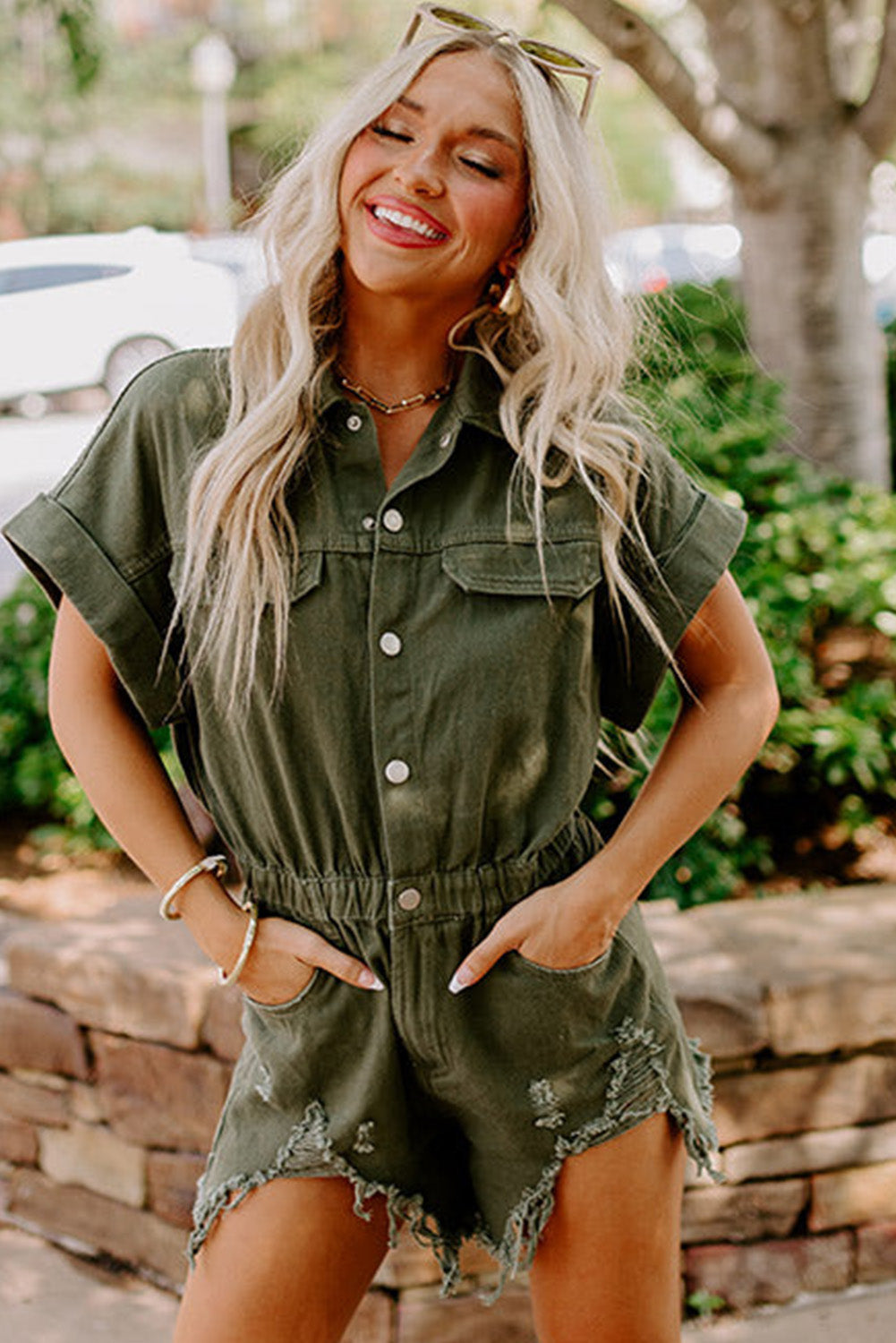 Moss Green Distressed Frayed Denim Romper featuring rolled cuffs and button closure, perfect for casual outings.