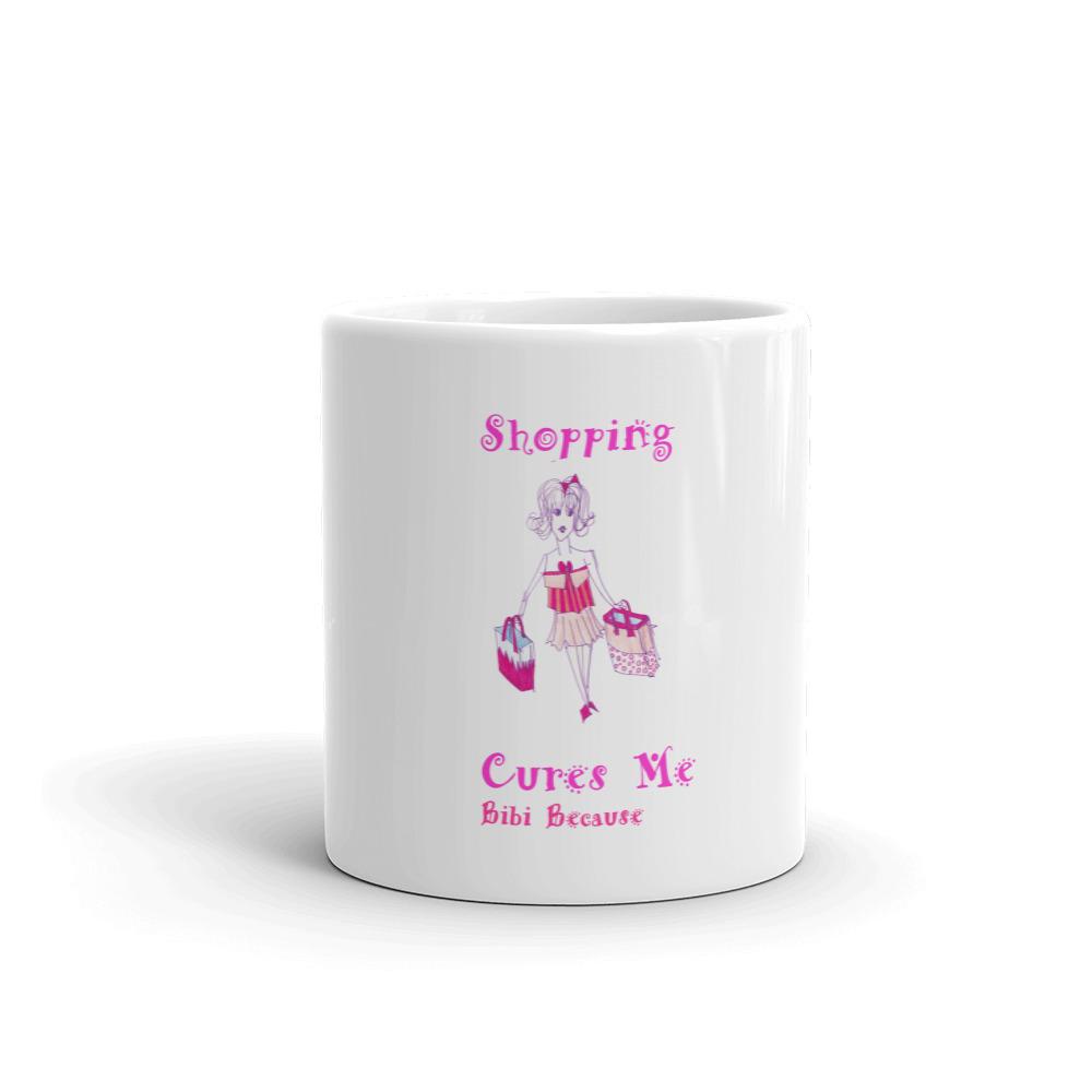 Mug Bibi Because Collection featuring a glossy white finish with the phrase 'Shopping Cures Me' printed in vibrant colors.