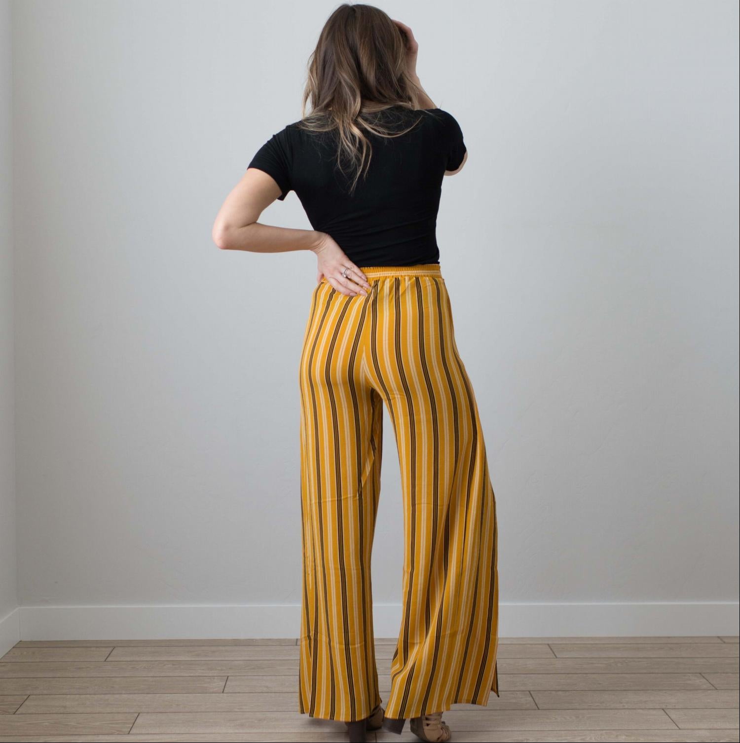 Multi Striped Wrap Pants featuring vertical stripes, a tie front, and a deep side slit, perfect for stylish comfort.