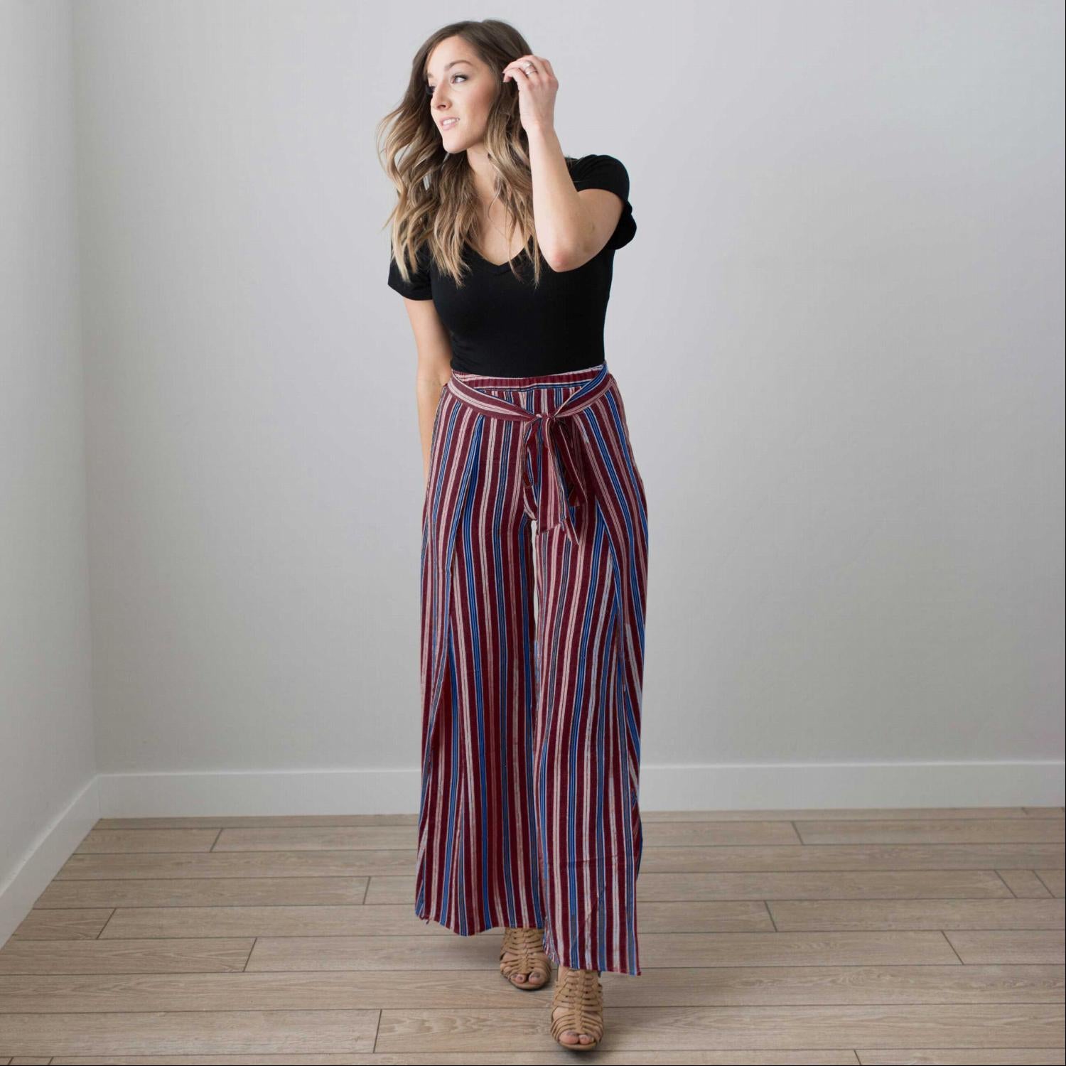 Multi Striped Wrap Pants featuring vertical stripes, a tie front, and a deep side slit, perfect for stylish comfort.