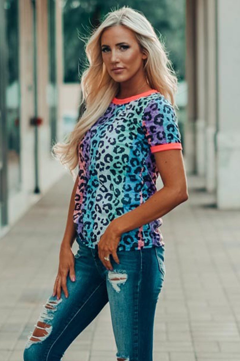 Multicolor Base Leopard T-shirt featuring an all-over leopard print design with a glowing round neckline and sleeve cuffs.