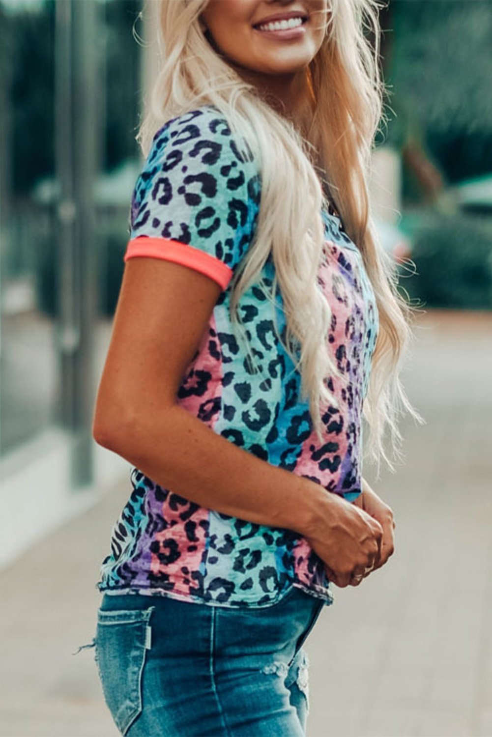 Multicolor Base Leopard T-shirt featuring an all-over leopard print design with a glowing round neckline and sleeve cuffs.