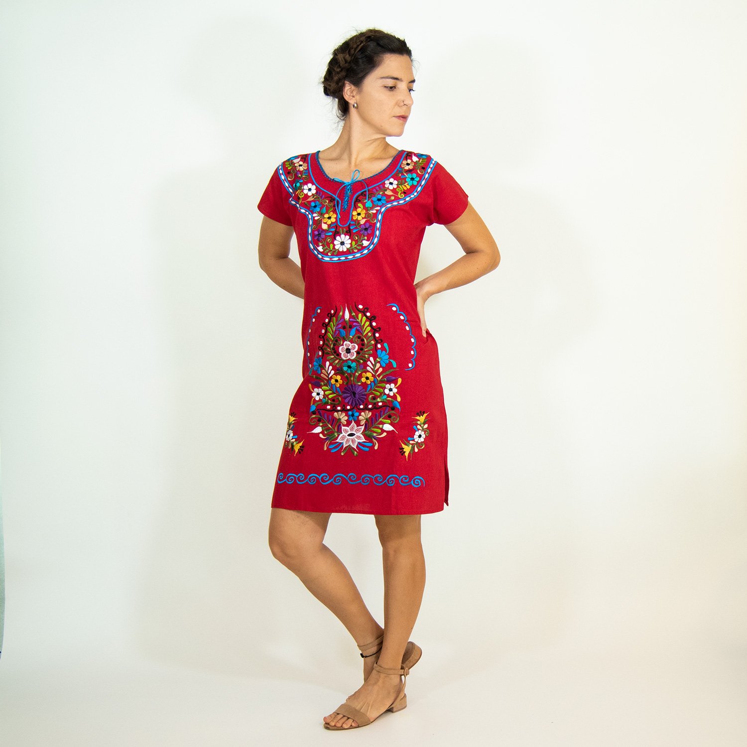 A vibrant Multi-Color Embroidery Mexican Dress featuring intricate floral designs, showcasing the craftsmanship of artisans from Puebla, Mexico.