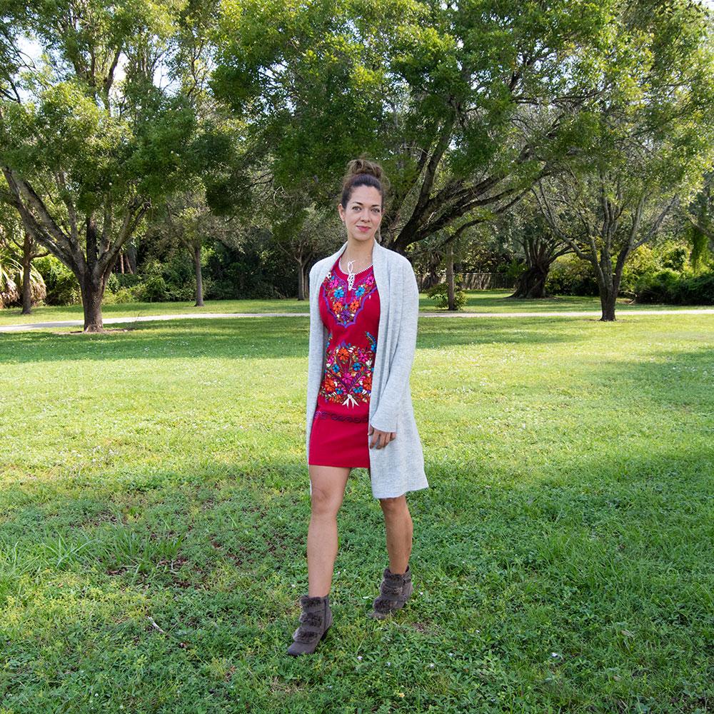 A vibrant Multi-Color Embroidery Mexican Dress featuring intricate floral designs, showcasing the craftsmanship of artisans from Puebla, Mexico.