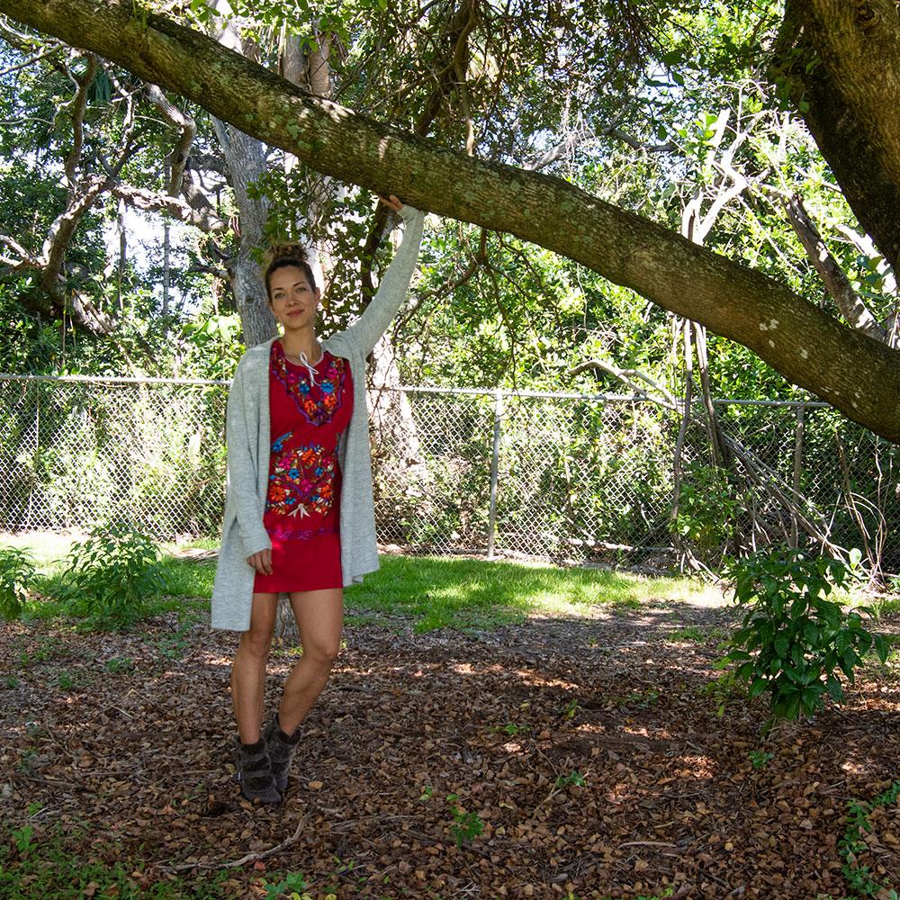 A vibrant Multi-Color Embroidery Mexican Dress featuring intricate floral designs, showcasing the craftsmanship of artisans from Puebla, Mexico.