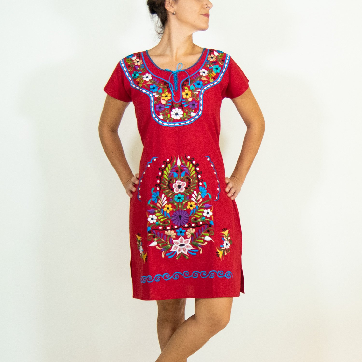 A vibrant Multi-Color Embroidery Mexican Dress featuring intricate floral designs, showcasing the craftsmanship of artisans from Puebla, Mexico.