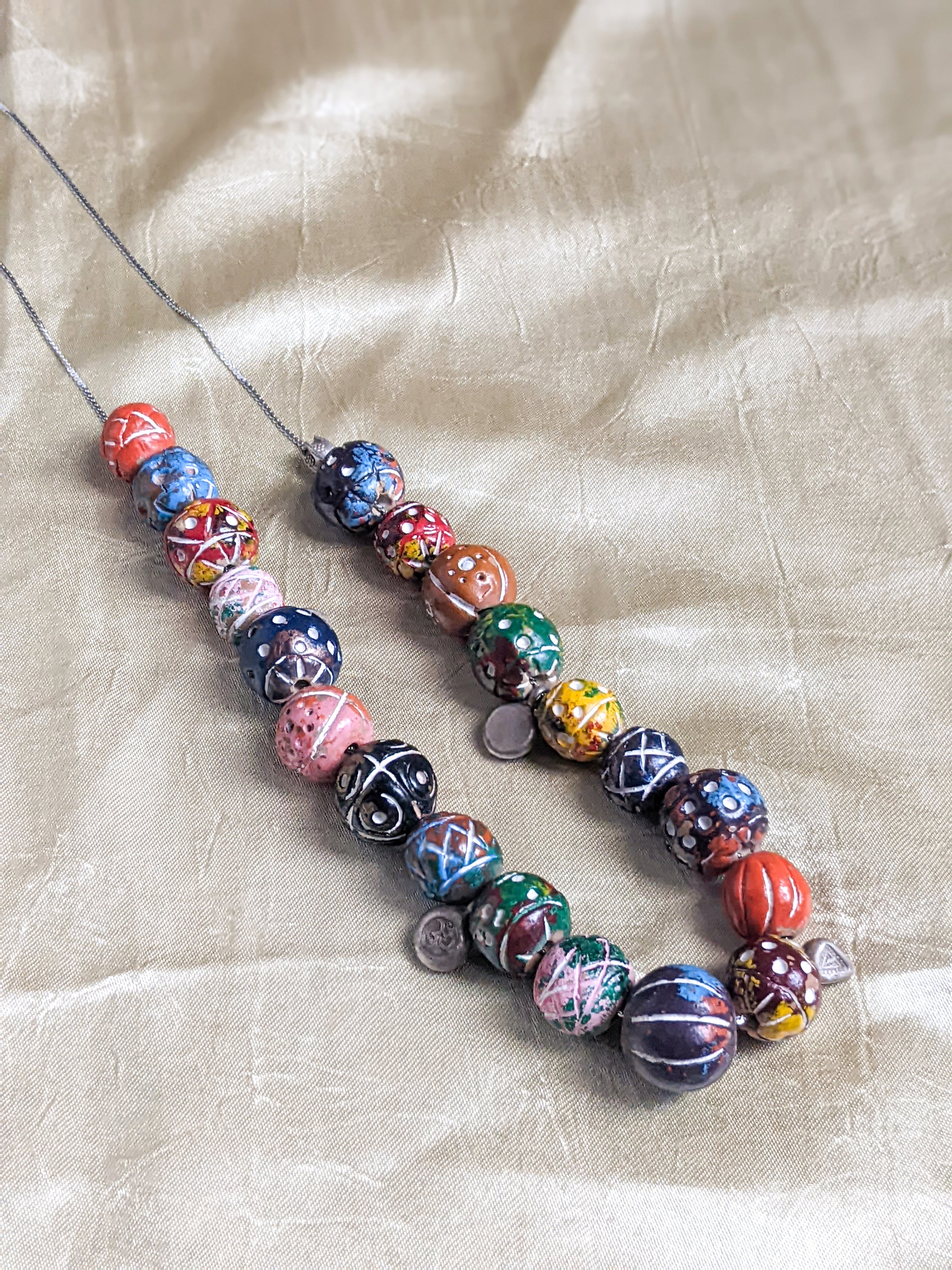 A beautifully handcrafted multicolor stones necklace featuring vibrant Finike stones elegantly paired with a durable silver chain.