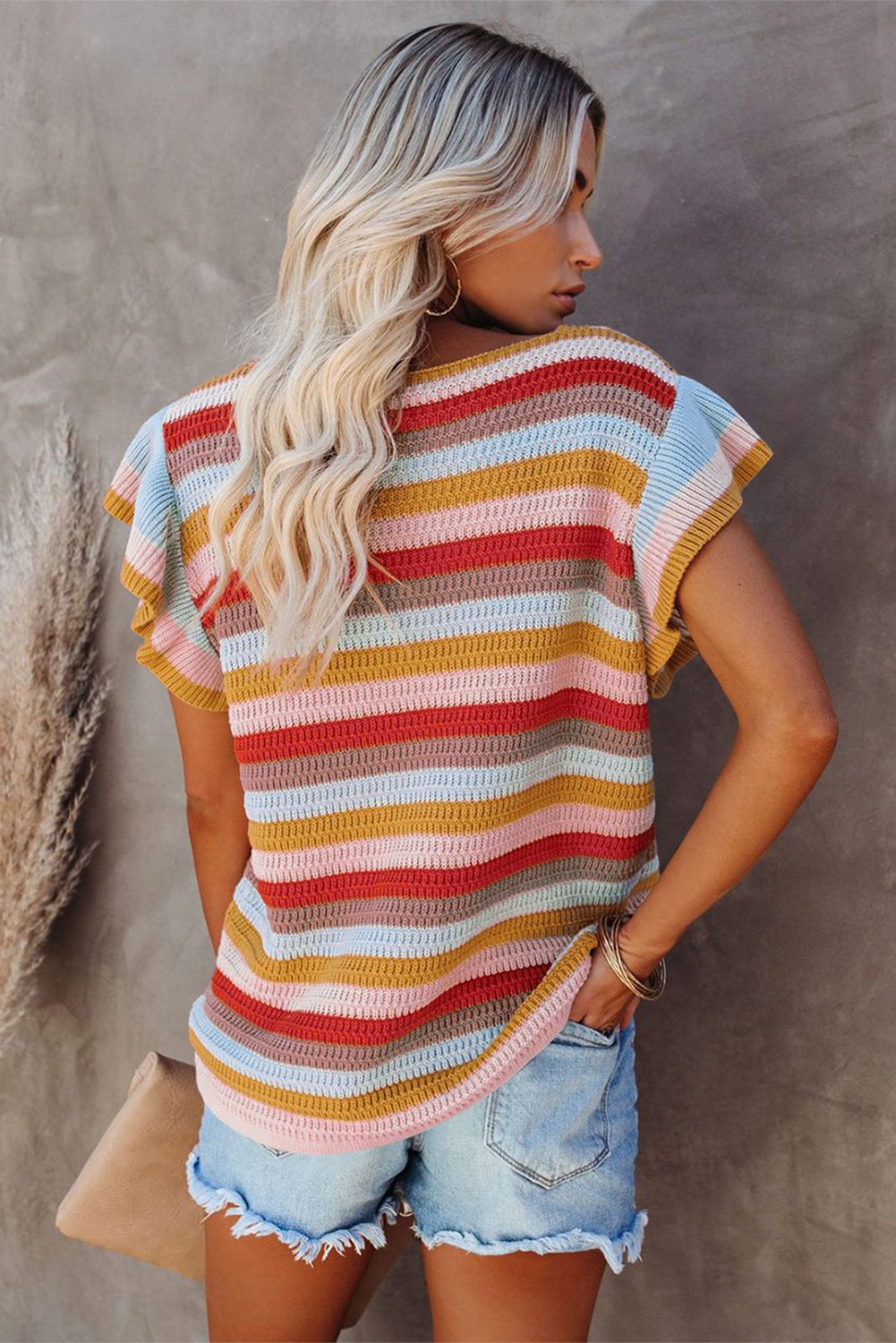 A stylish multi-color striped ruffle short sleeve knit top featuring a deep V-neck and loose hem, perfect for casual and sporty looks.