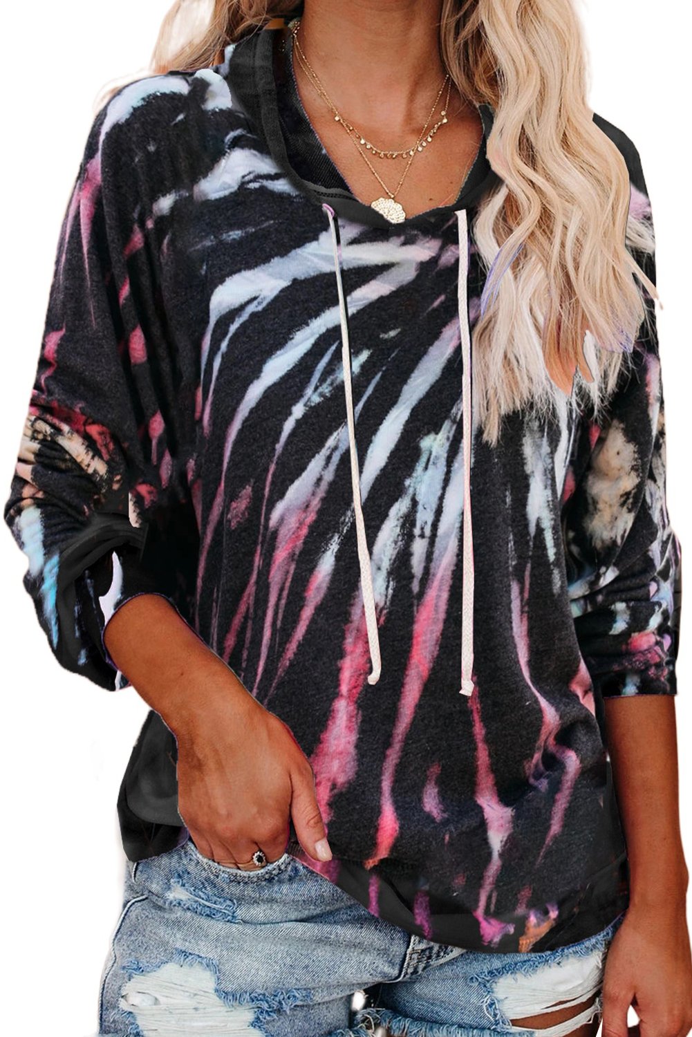 A stylish multicolor tie-dye knit hoodie displayed on a mannequin, showcasing its vibrant colors and relaxed fit.