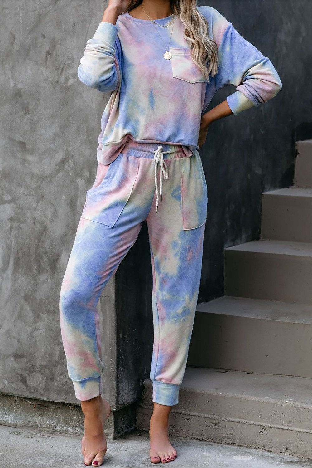 Multicolor Tie-dye Knit Lounge Set featuring a vibrant tie-dye pattern, crew neckline, long sleeves, and a chest pocket, perfect for casual lounging.