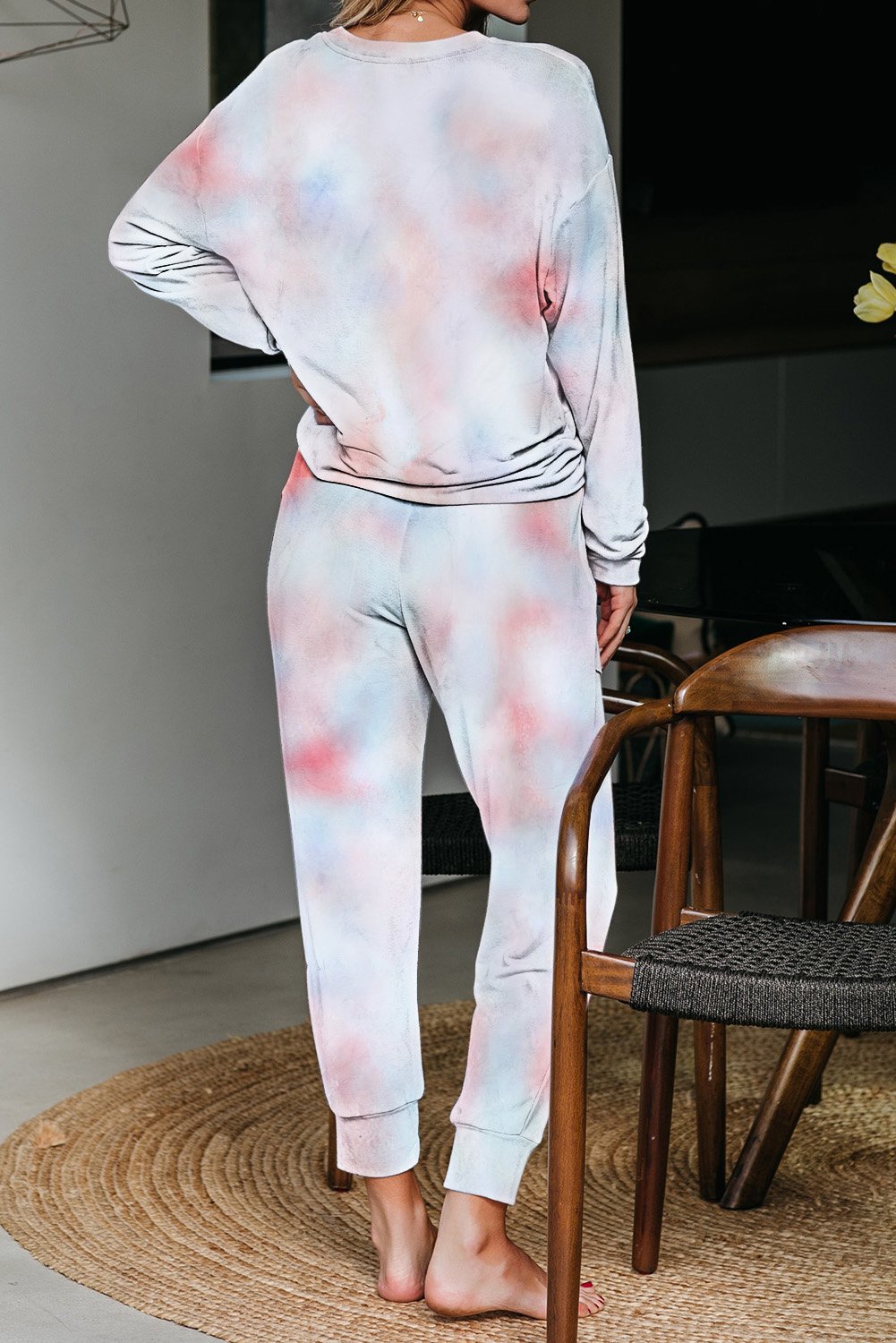 Multicolor Tie-dye Knit Lounge Set featuring a vibrant tie-dye pattern, crew neckline, long sleeves, and a chest pocket, perfect for casual lounging.