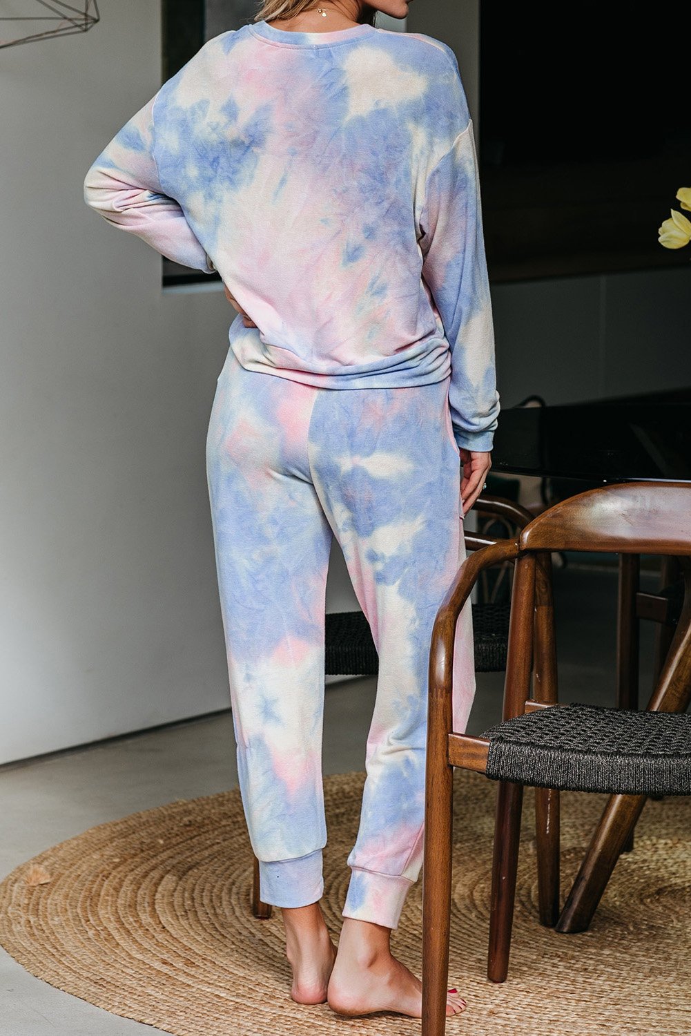 Multicolor Tie-dye Knit Lounge Set featuring a vibrant tie-dye pattern, crew neckline, long sleeves, and a chest pocket, perfect for casual lounging.