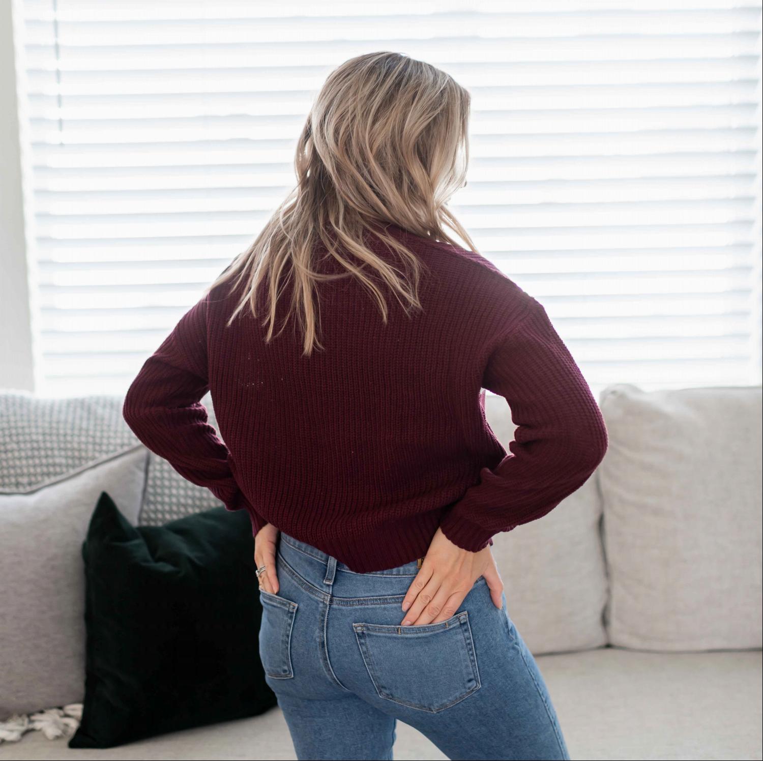 A cozy multi-striped round neck long sleeve sweater with ribbed cuffs, perfect for autumn wear.