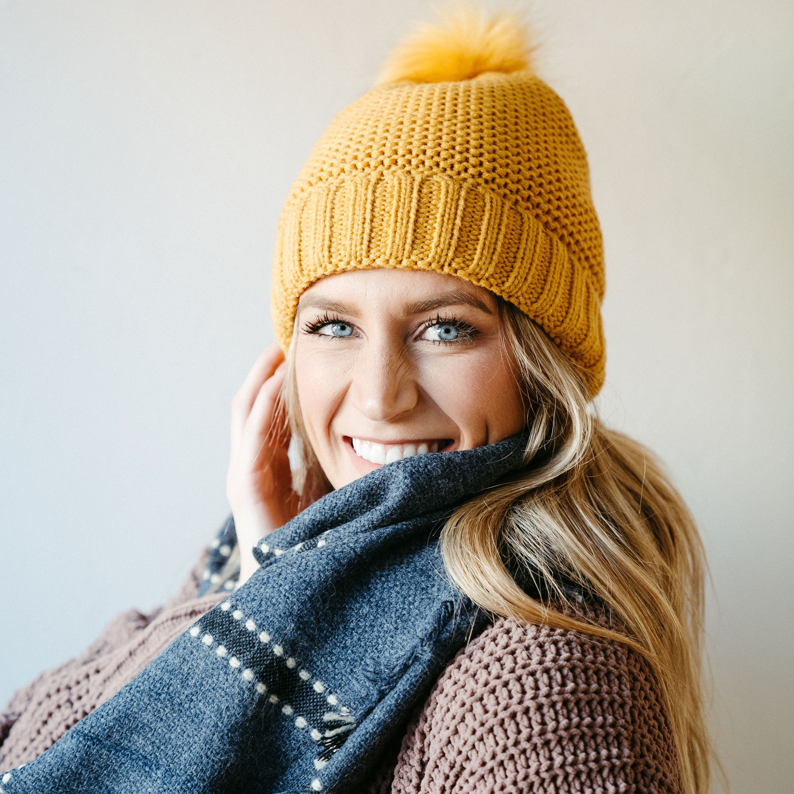 Mustard Sherpa-Lined Beanie with soft interior and cute pompom on top, perfect for winter wear.