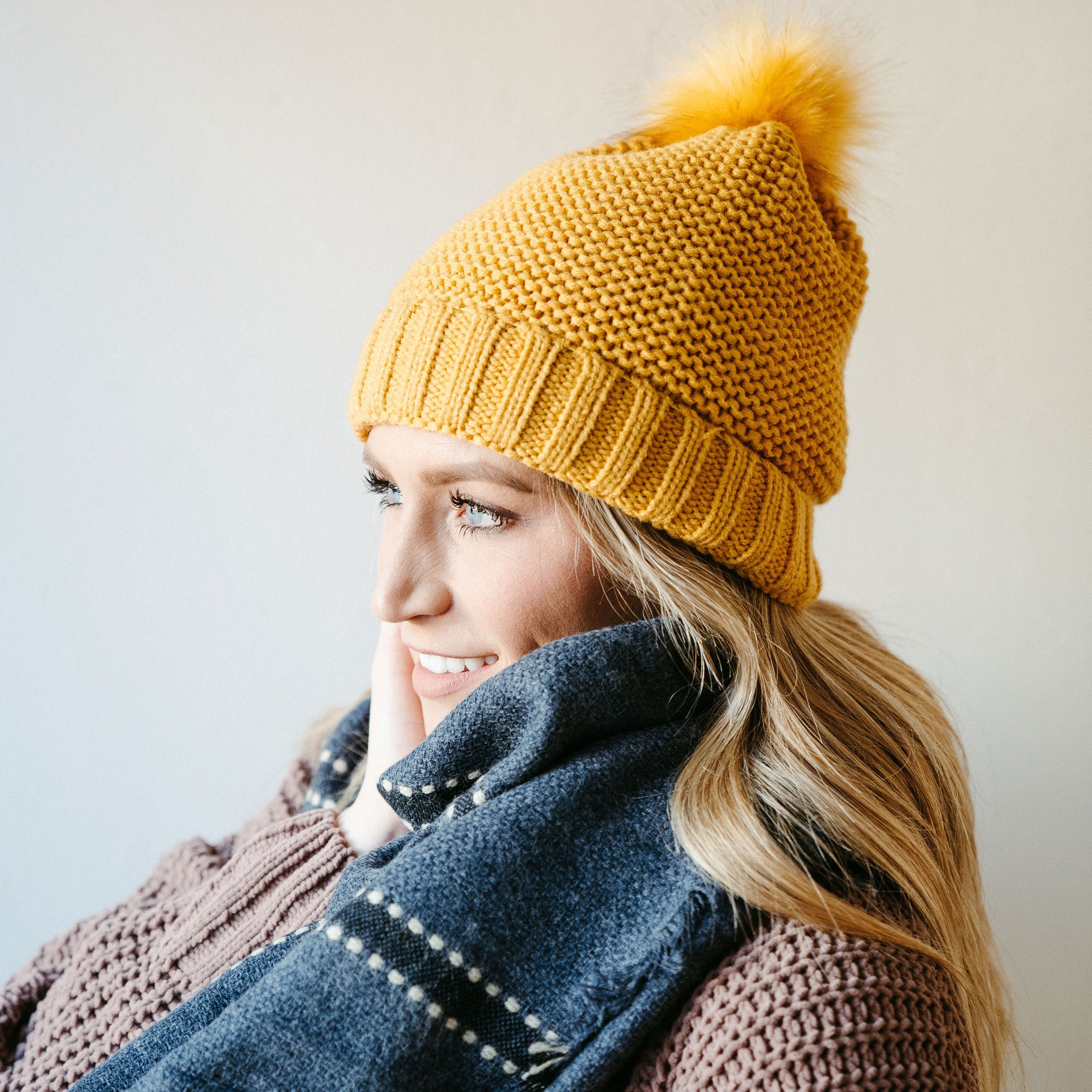 Mustard Sherpa-Lined Beanie with soft interior and cute pompom on top, perfect for winter wear.