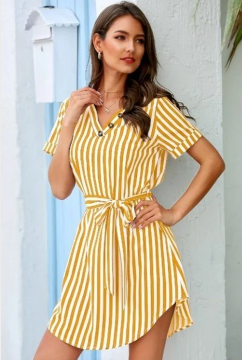 A stylish mustard striped shirt dress featuring a V-neck design, made from soft rayon and spandex, perfect for layering or wearing alone.