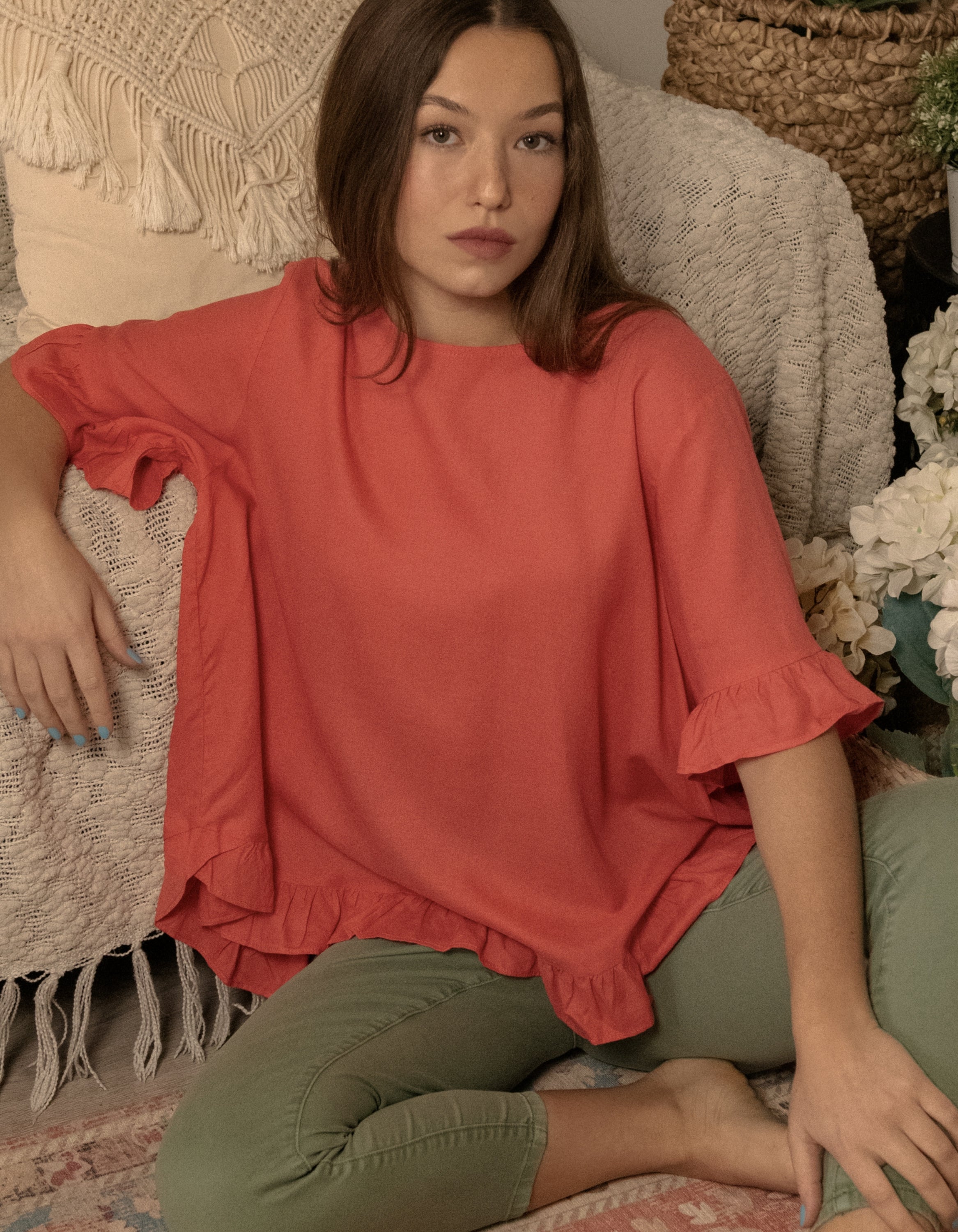 Mylene Top in a relaxed fit with frilled high-low hem, showcasing its breathable linen blend fabric and stylish design in vibrant colors.