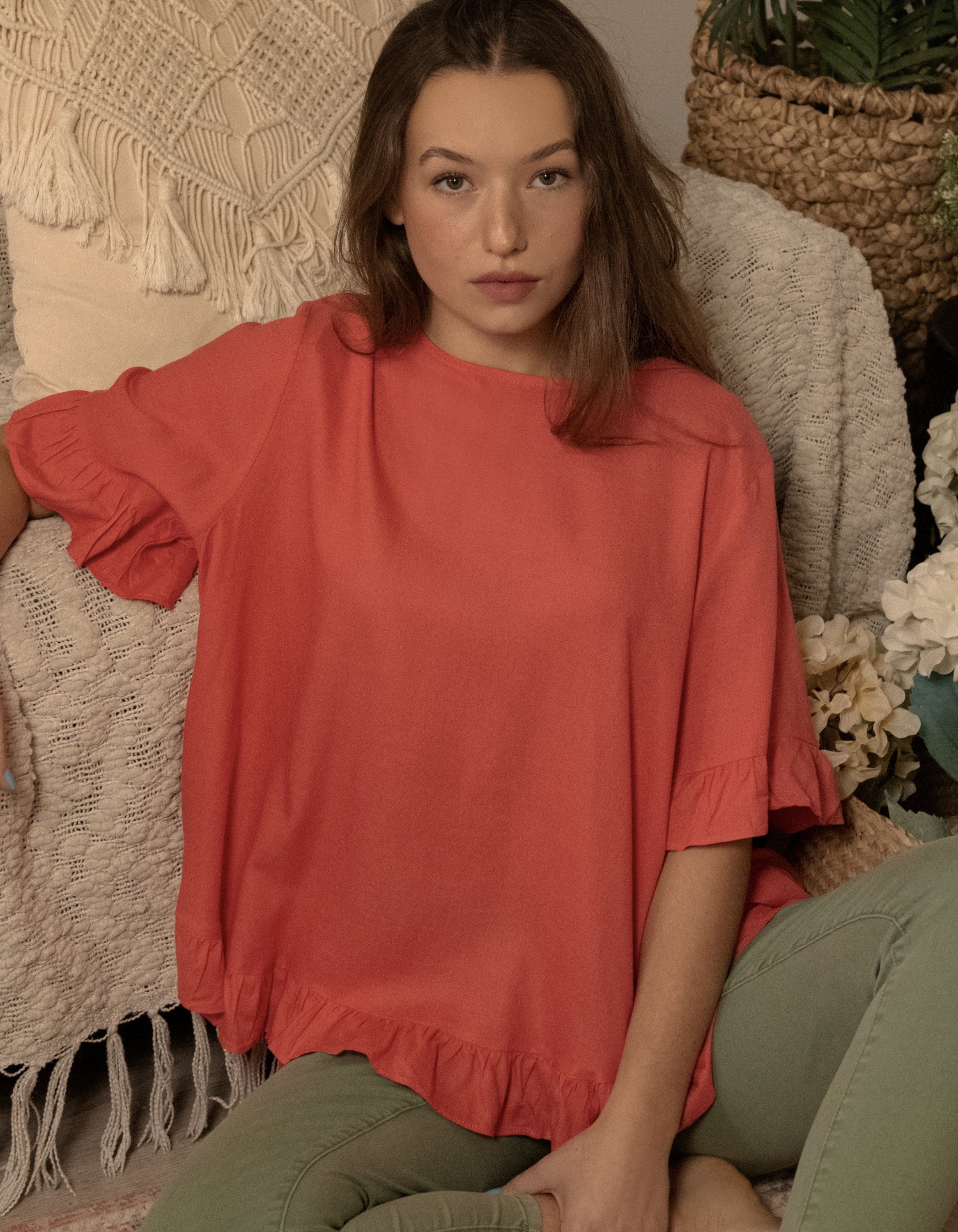 Mylene Top in a relaxed fit with frilled high-low hem, showcasing its breathable linen blend fabric and stylish design in vibrant colors.