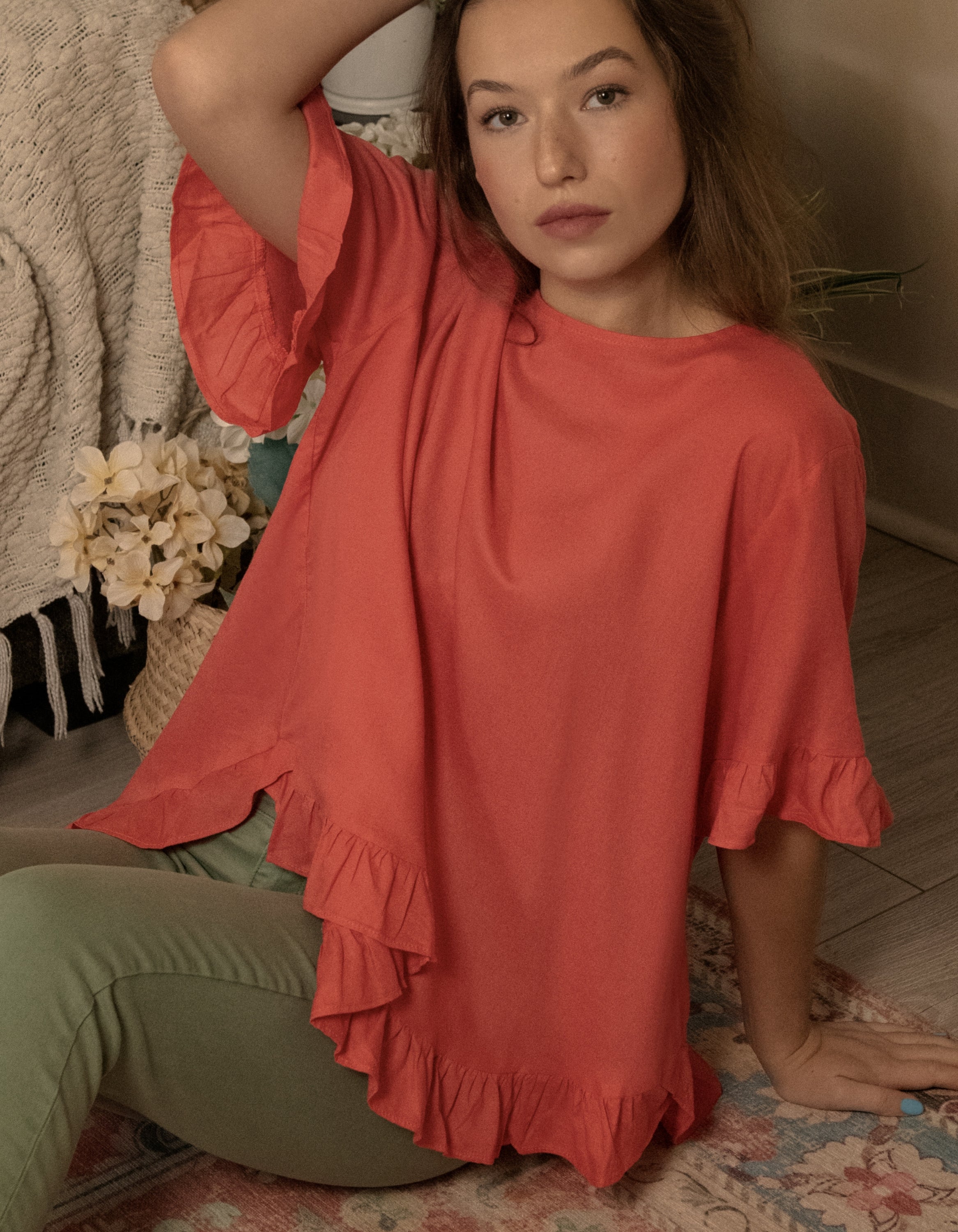 Mylene Top in a relaxed fit with frilled high-low hem, showcasing its breathable linen blend fabric and stylish design in vibrant colors.