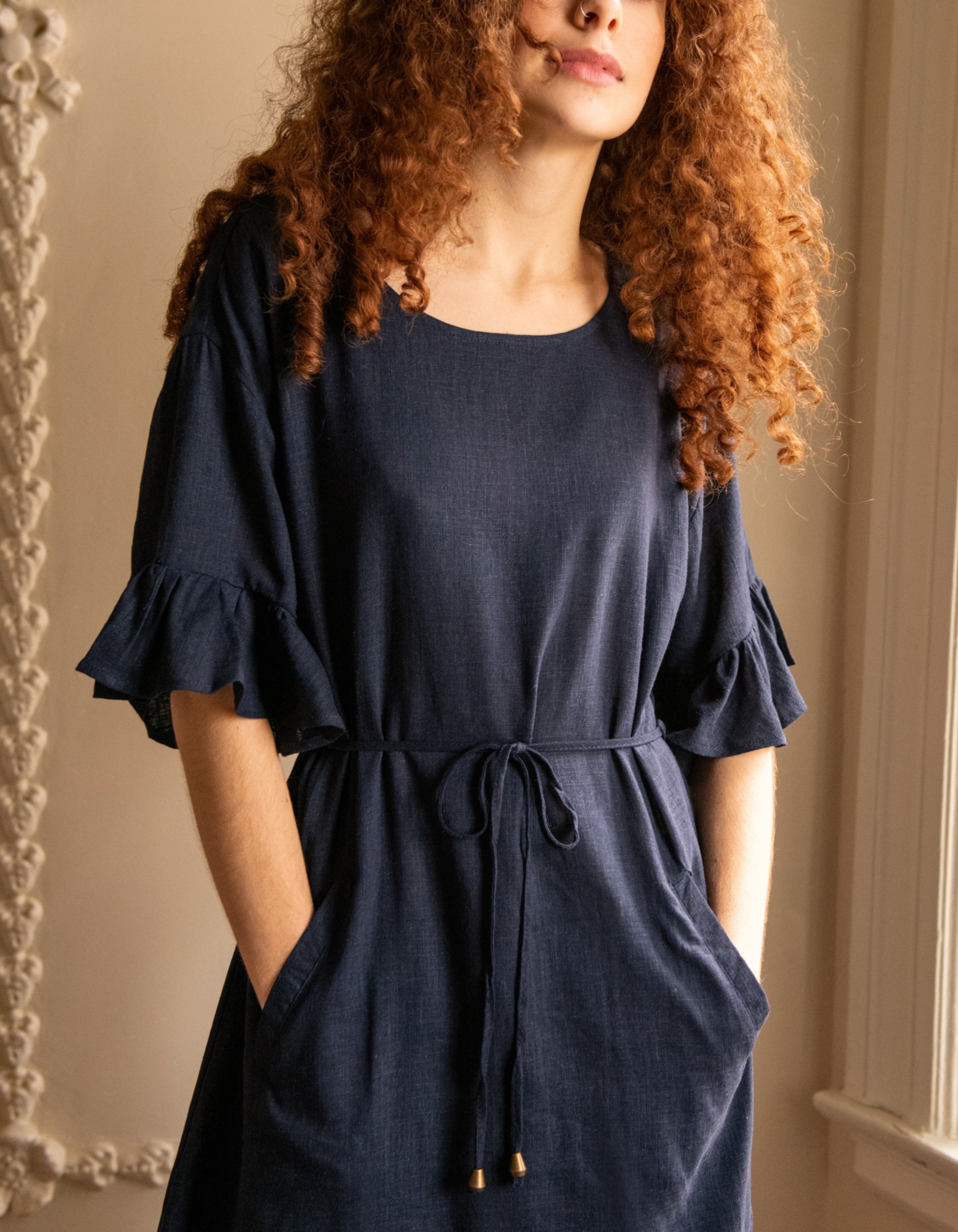 Myriam Dress in solid navy blue, featuring half frill sleeves and a self-tie waist, perfect for casual chic styling.