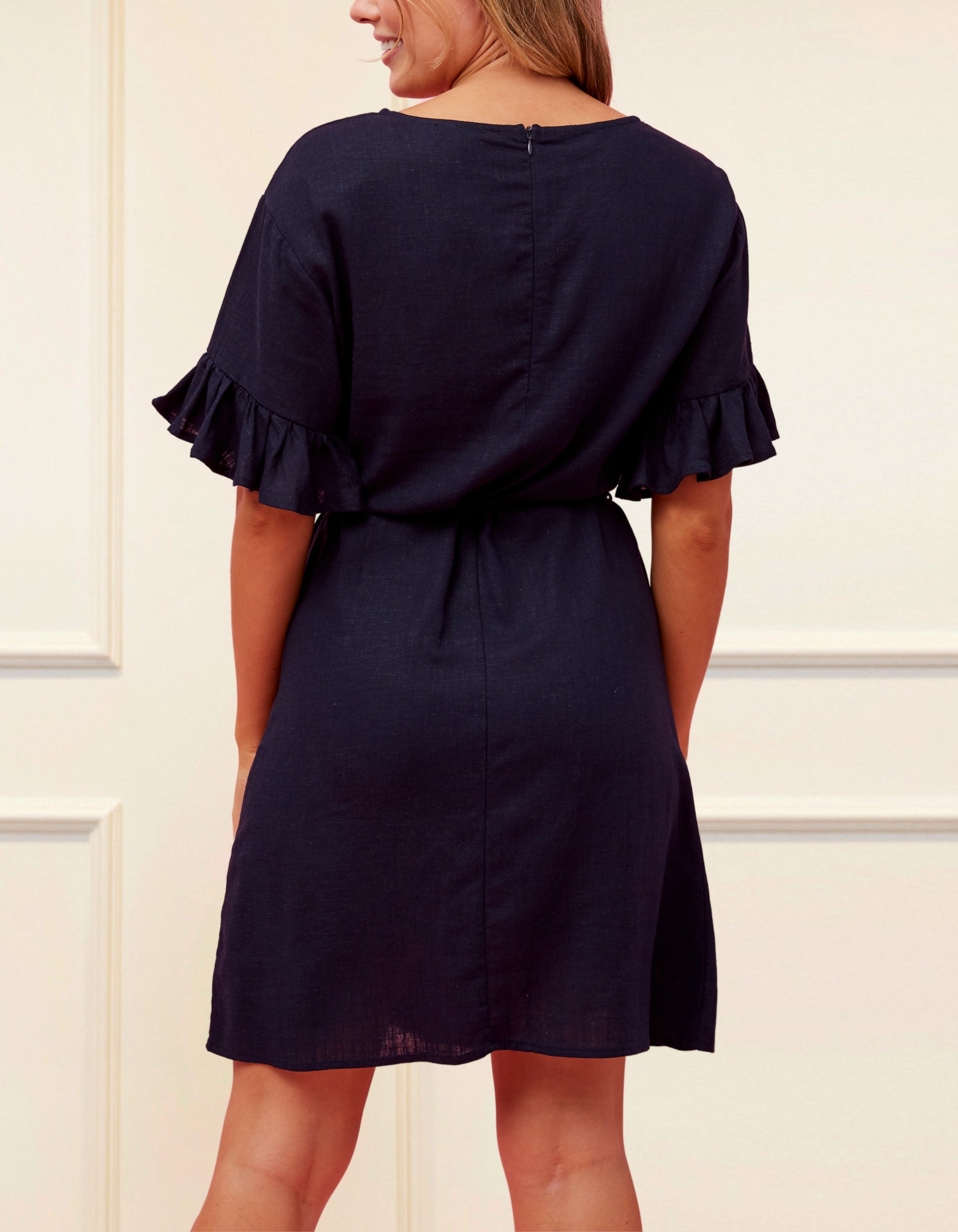 Myriam Dress in solid navy blue, featuring half frill sleeves and a self-tie waist, perfect for casual chic styling.